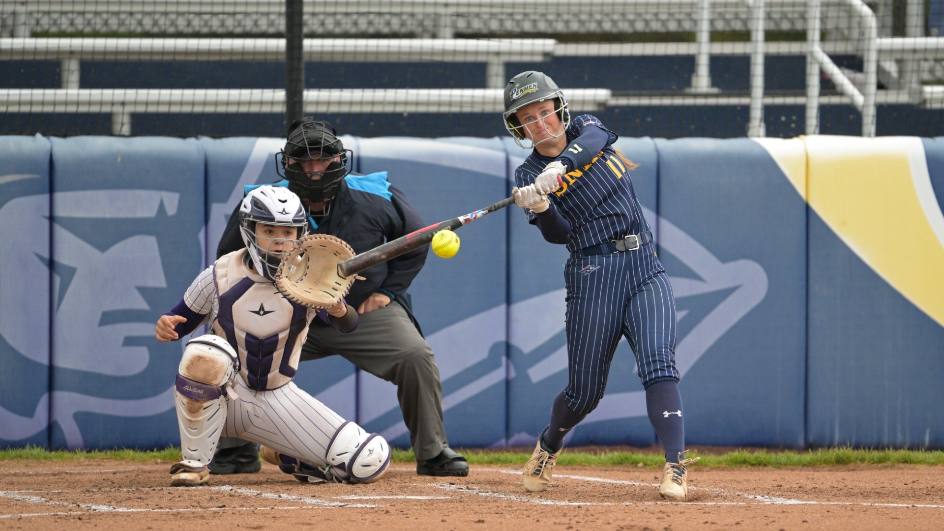 Alyssa Abbott takes a swing at a pitch for softball