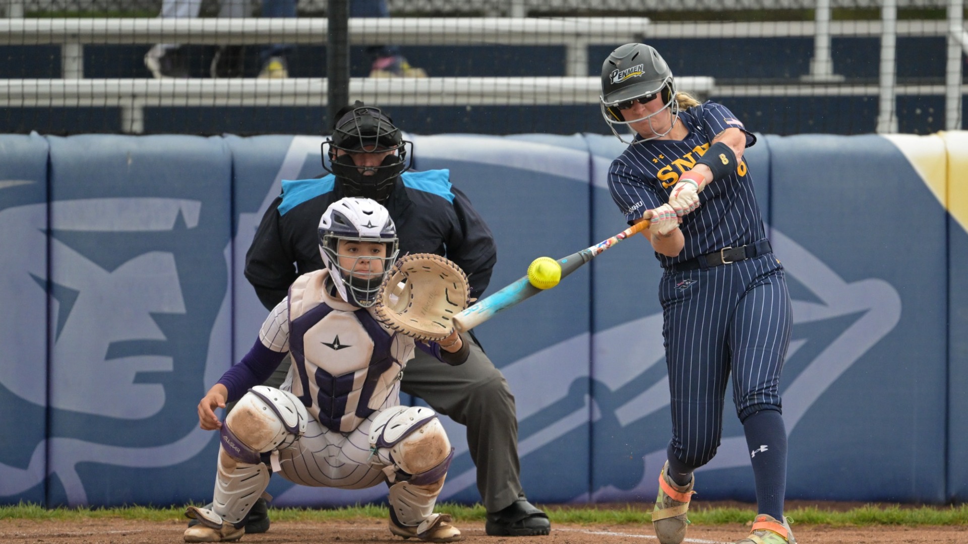 Sid Rose of softball makes contact with a pitch