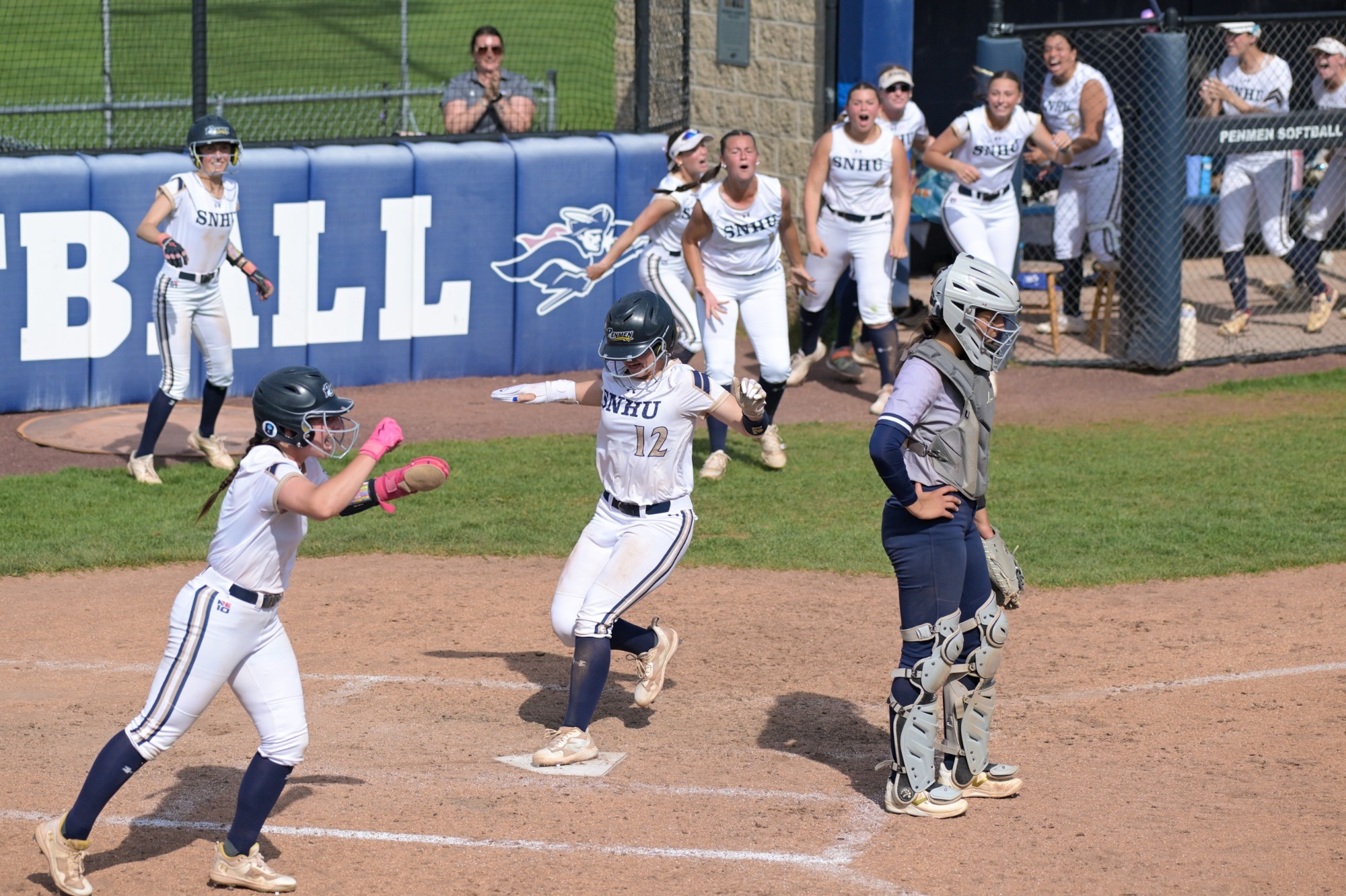 Kaysie DeMoura of softball scores the game-winning run in the first round of the NE10 Championship