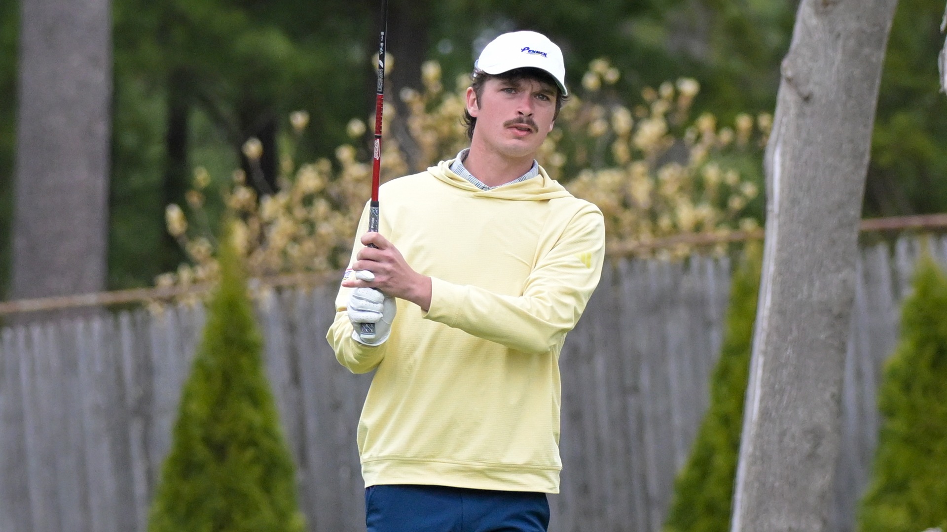 Sean Dully holding his club, while watching his shot