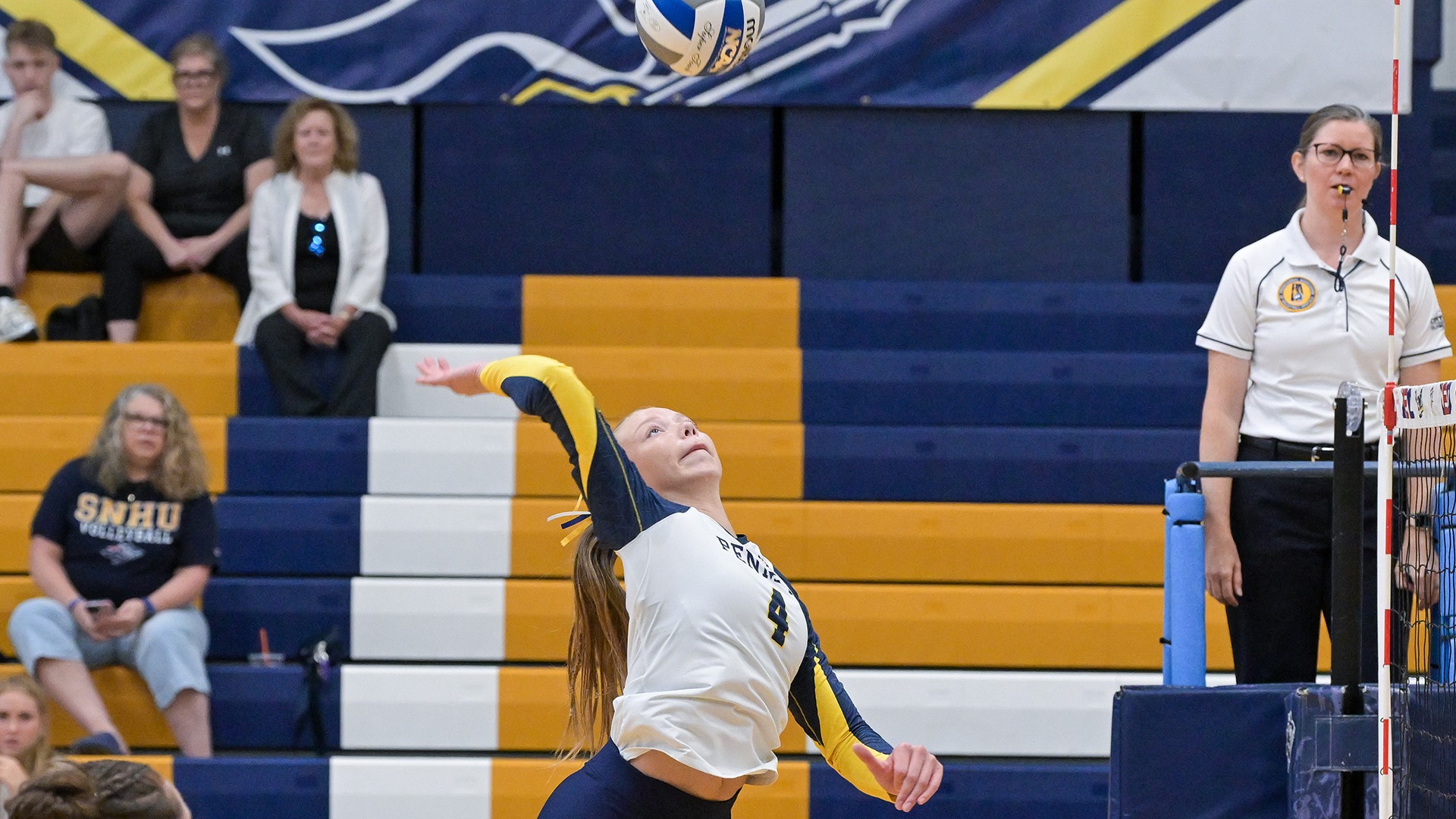Jordyn Carroll jumping to attack the ball at the net