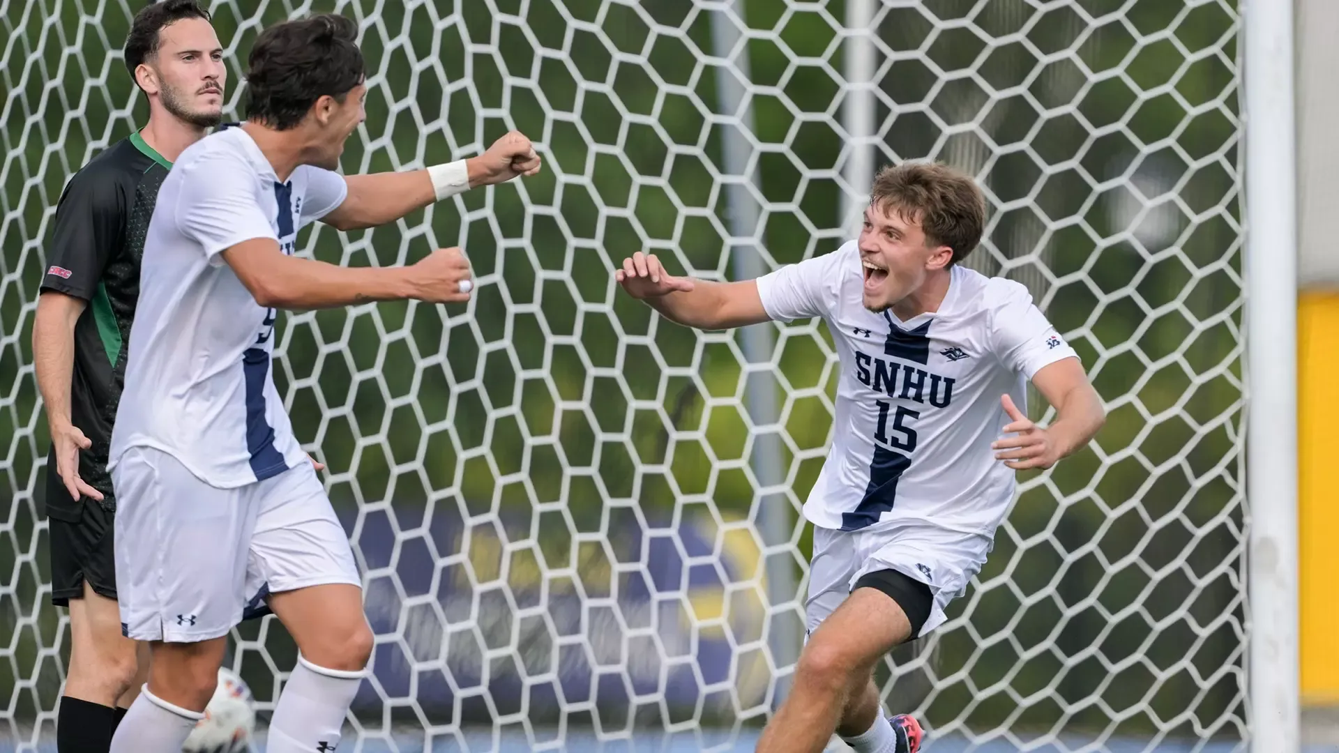 Sean Correia celebrating his goal with a teammate