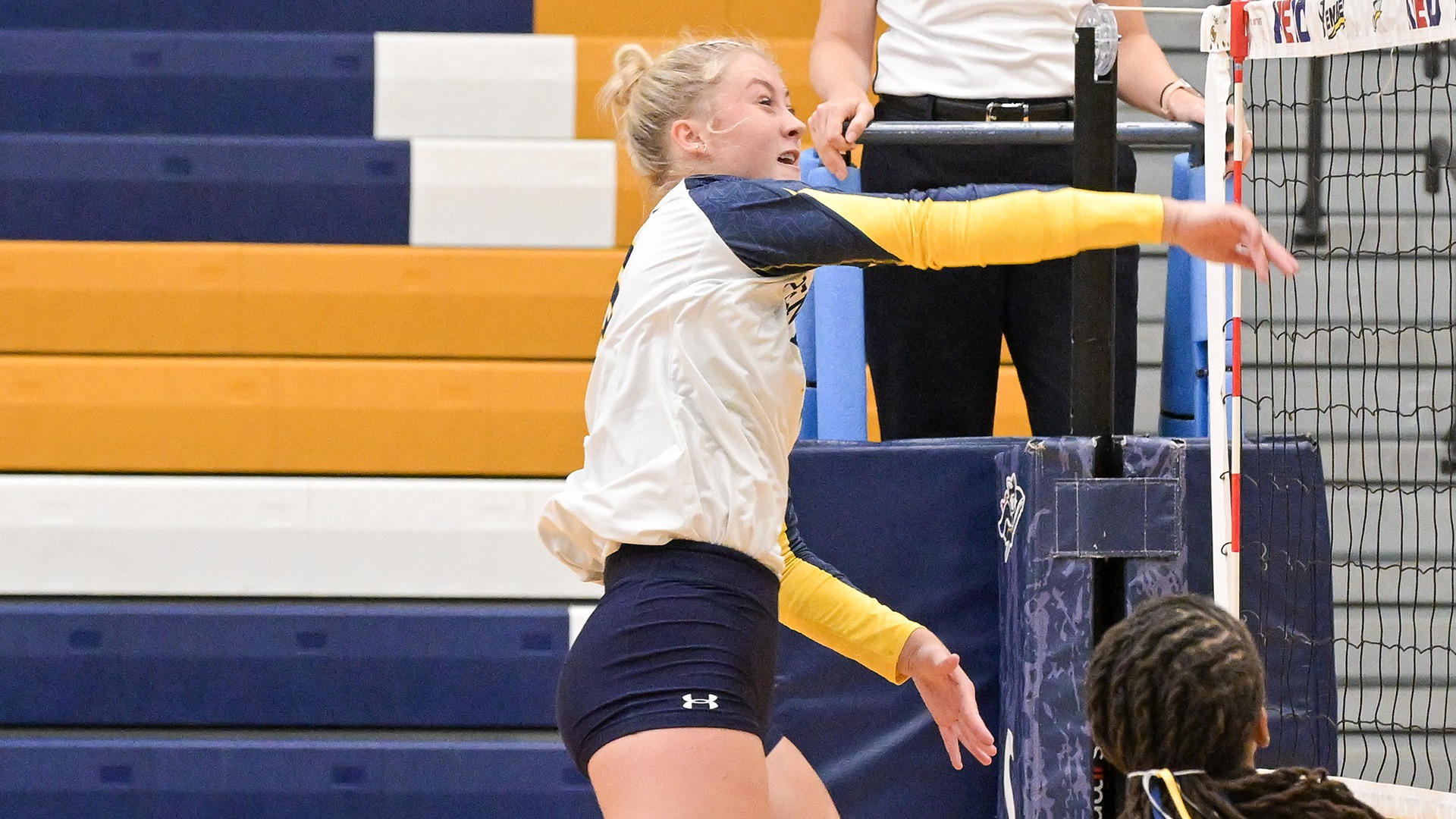 Elizabeth Descheneaux following through on a shot at the net