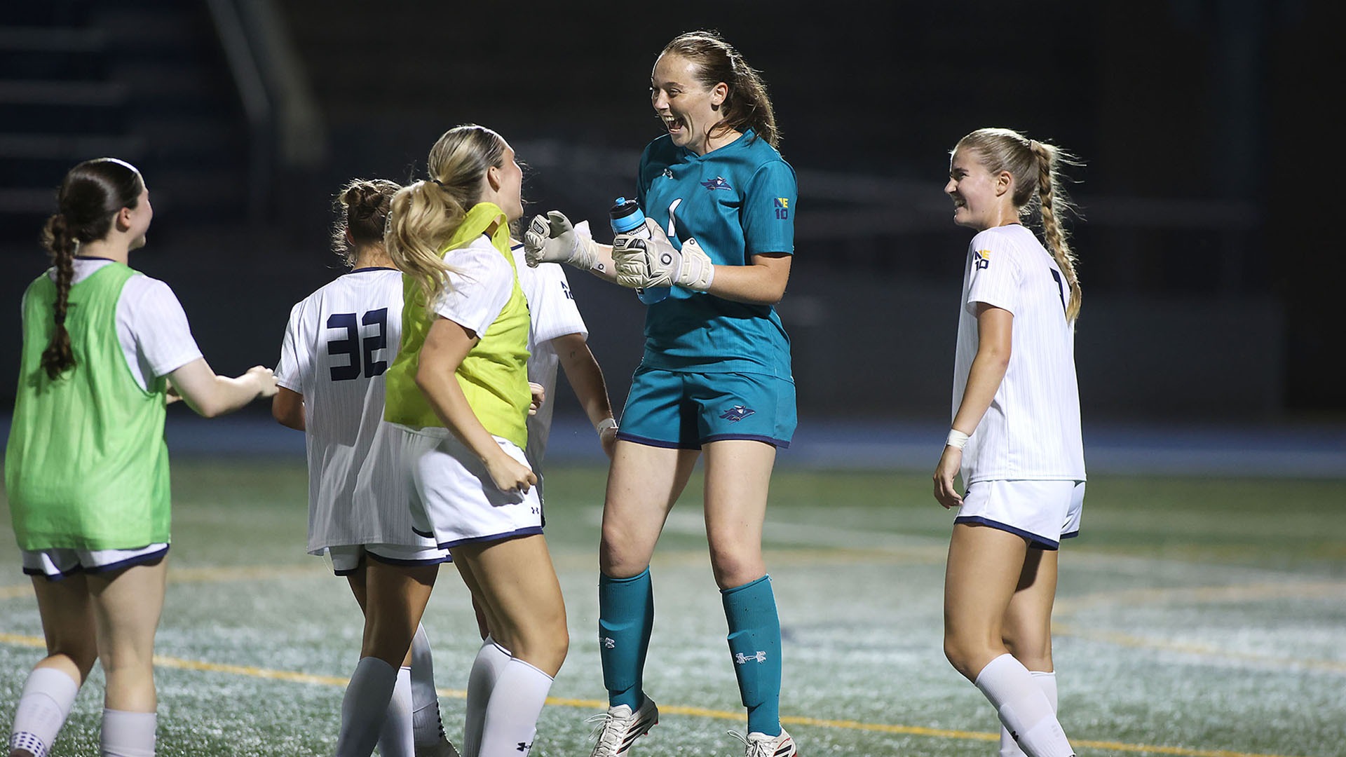 Isabel Hughes celebrating her first career shutout with teammates