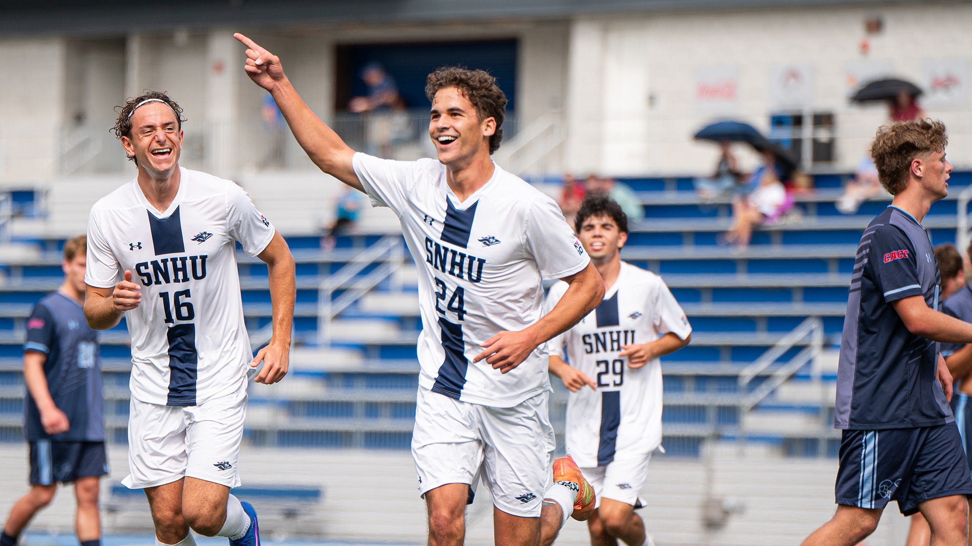 Ian Goulet celebrating alongside teammates after scoring his first career goal