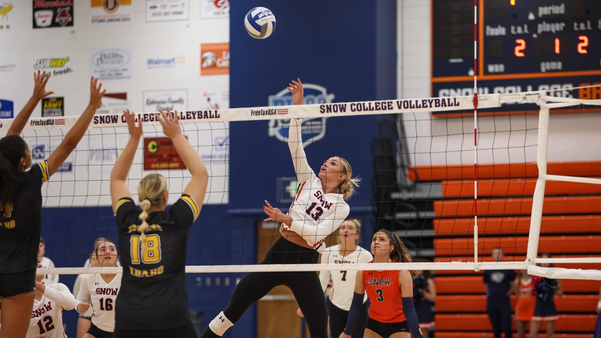 Chloee Leslie poking the ball over the net against CSI