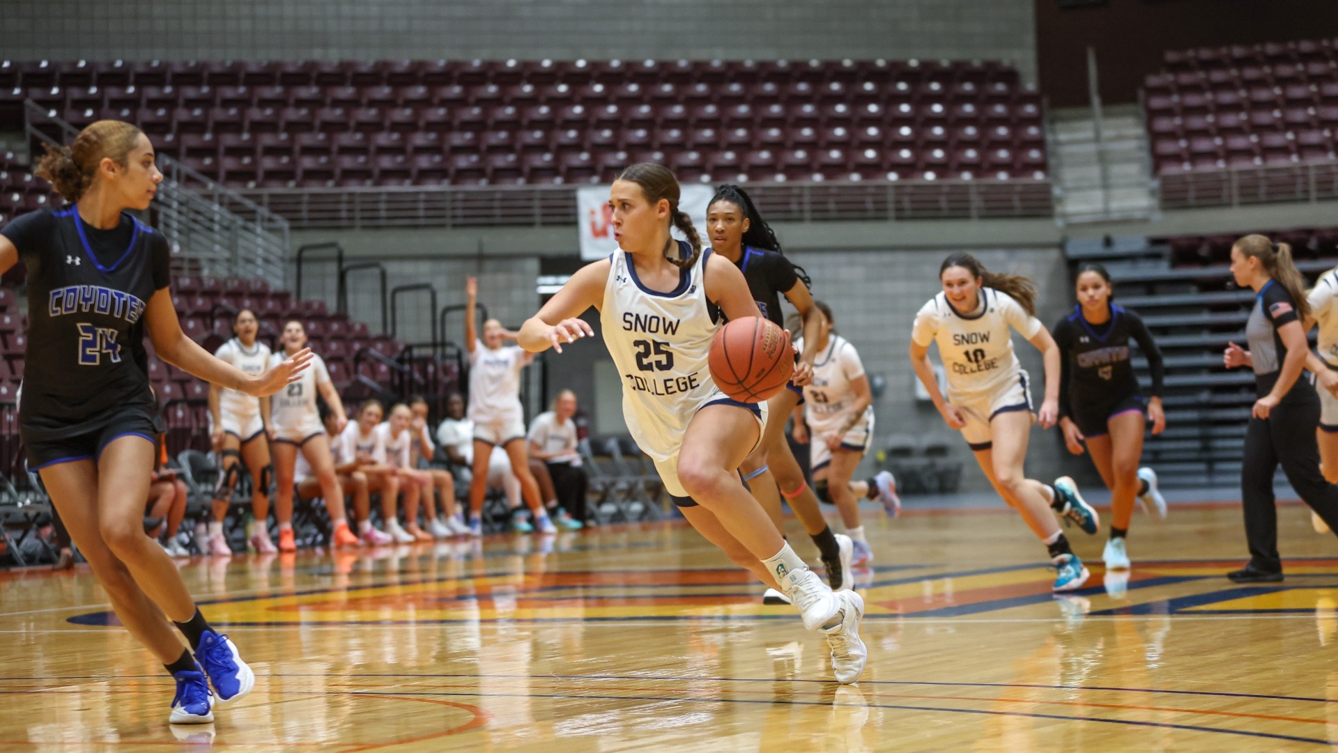 Avery Allred taking the ball up court on a fast break
