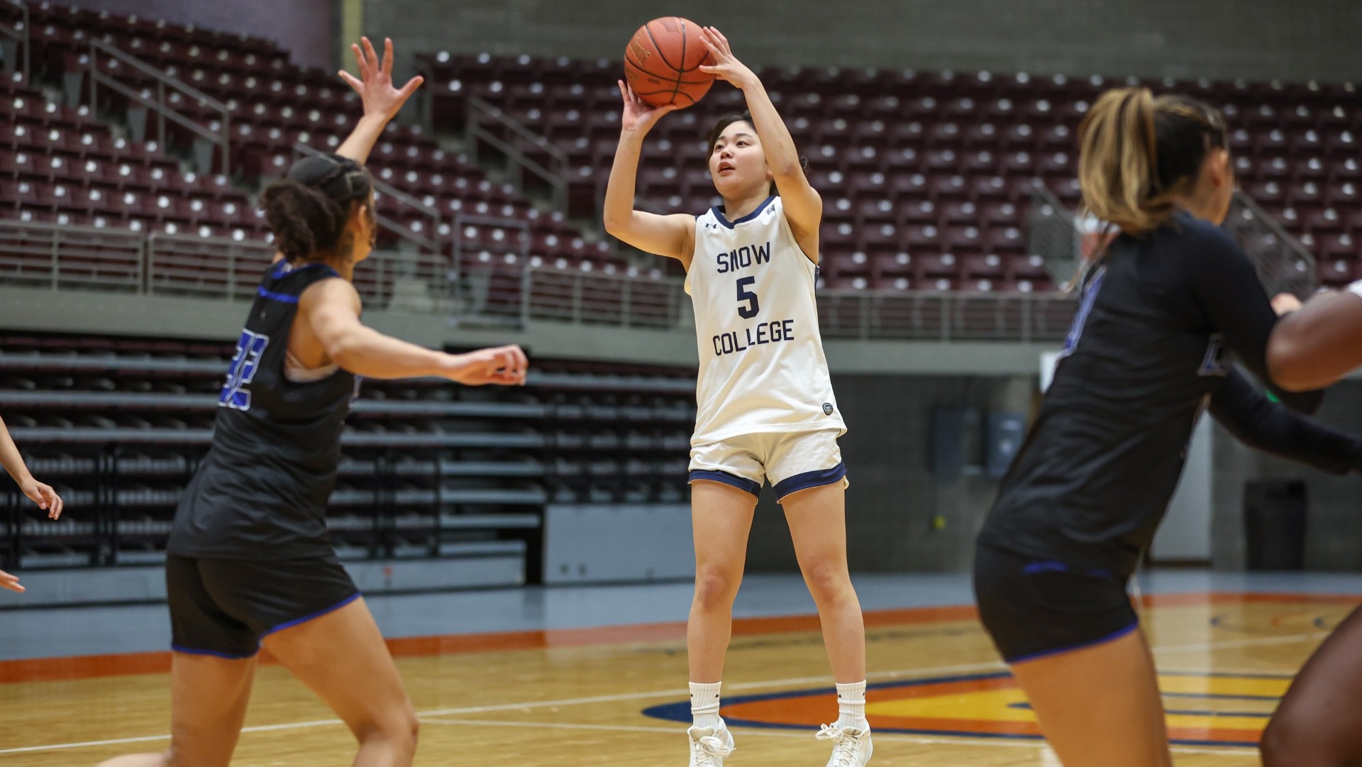 Sara Aoki putting up a shot behind the arc