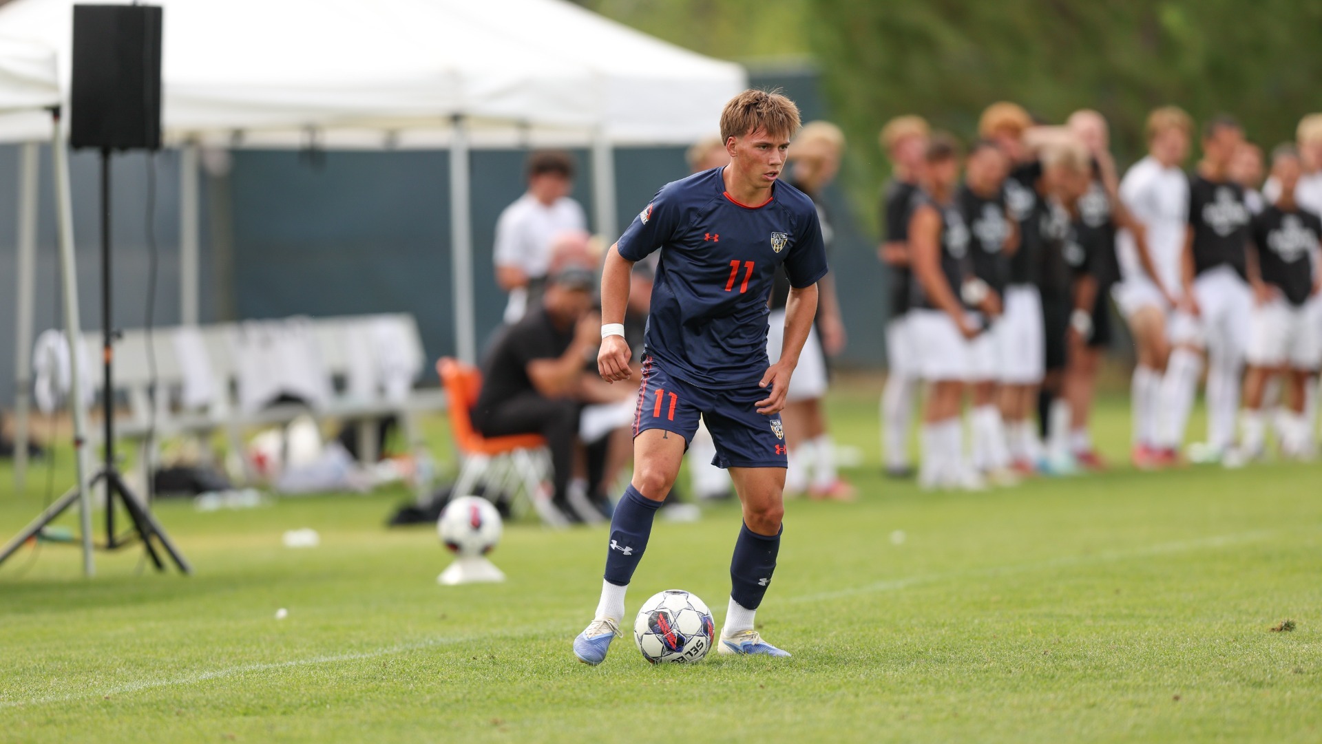 Kade Davis gathers a pass and looks for his next move