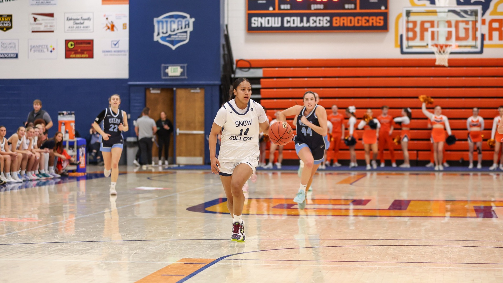 Seini Tuipulotu charging towards the basket on a fast break