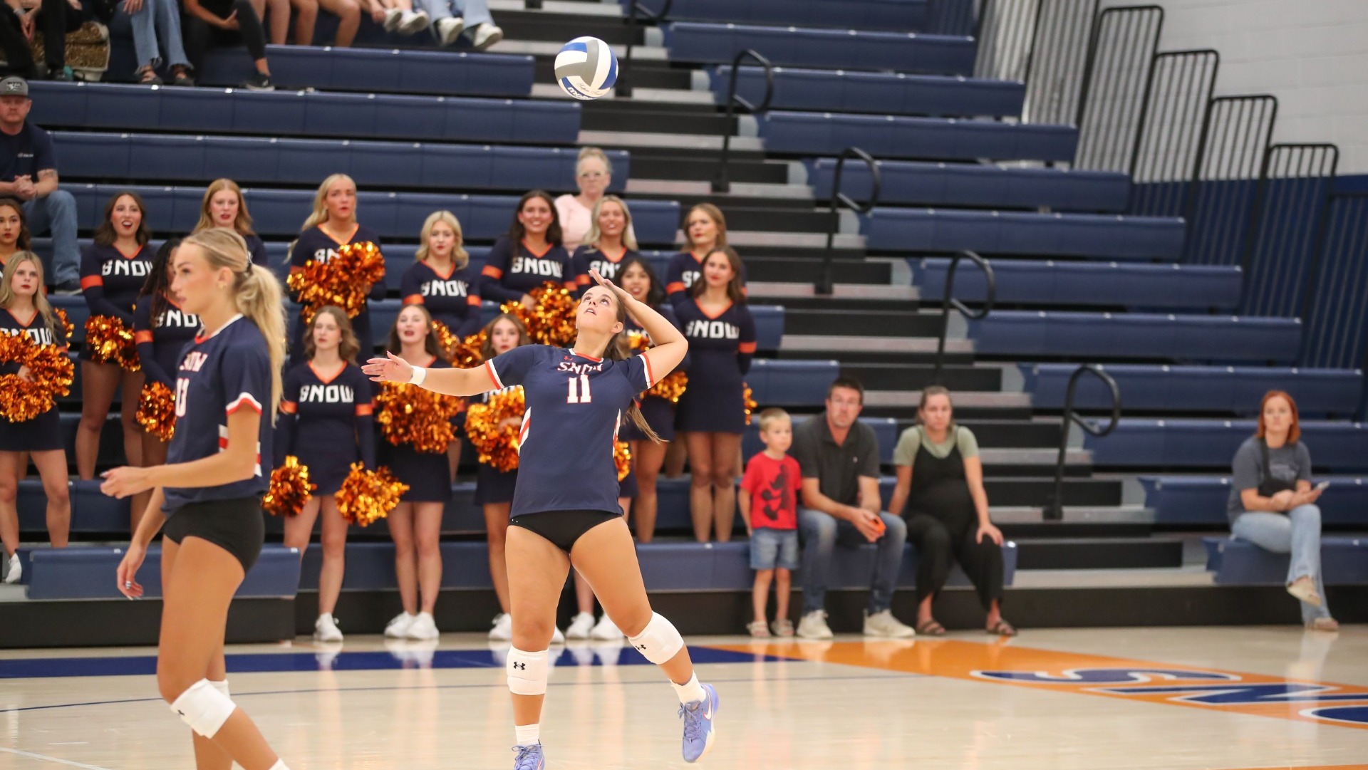 Sydney Short strikes the ball across the net against WWCC