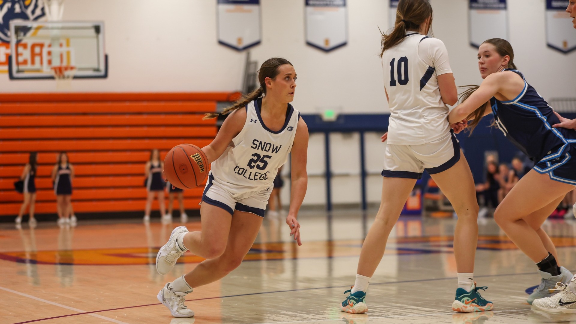 Avery Allred drives to the rim against USUE