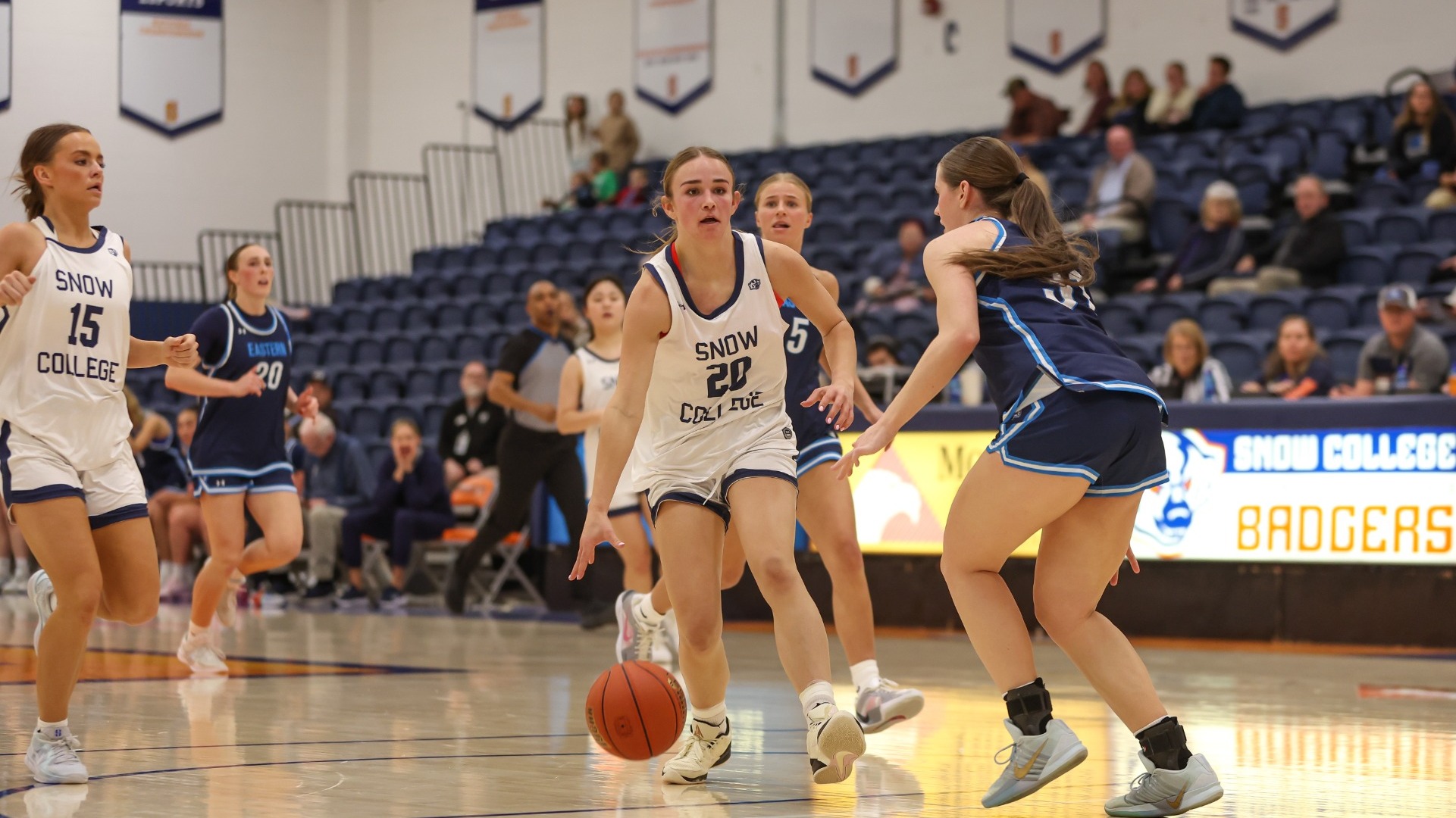 June Olsen driving to the rim against USUE