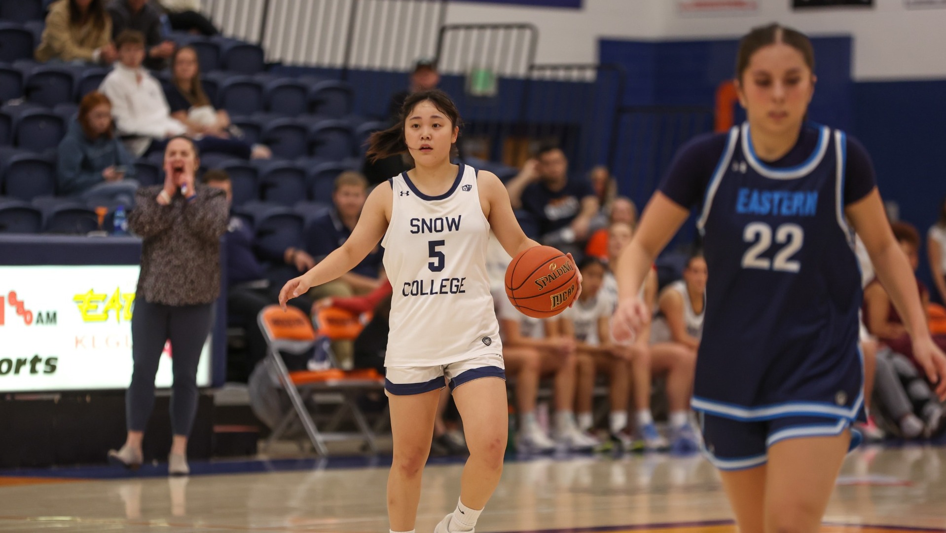 Sara Aoki bringing the ball up the court 