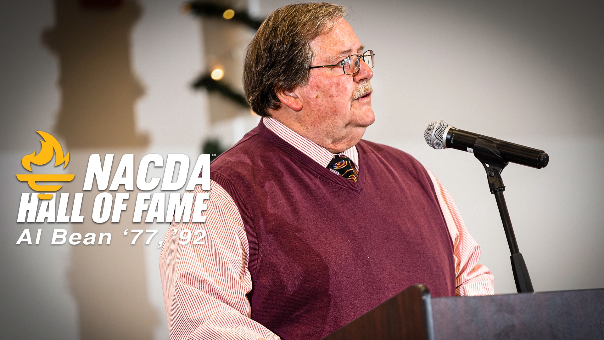 Al Bean, Former USM Athletic Director, Speaking at a Podium