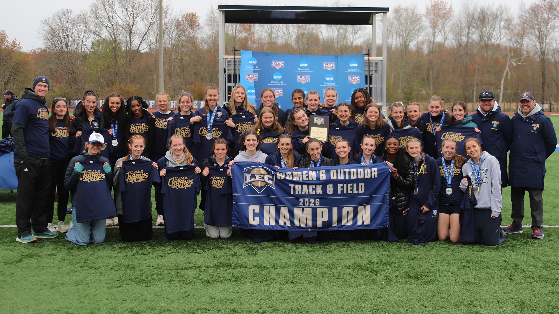 Southern Maine Women's Track and Field Team with 2026 LEC Championship Banner