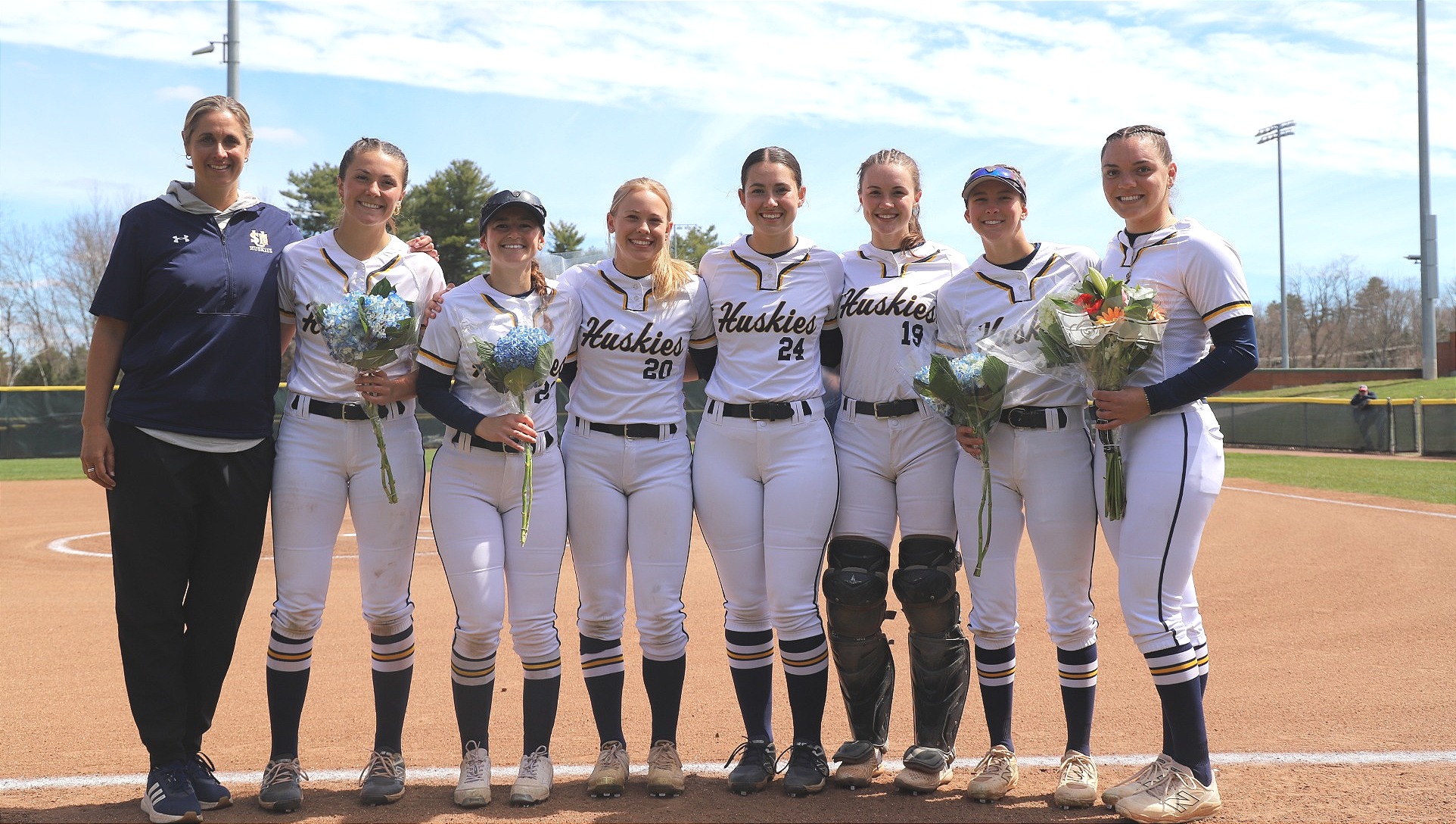 Head Coach Sarah Jamo with her Class of 2026 senior student-athletes
