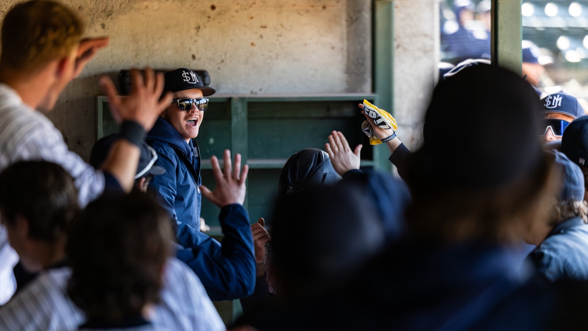 Huskies' Baseball Players Celebrate in Win Against Clark University