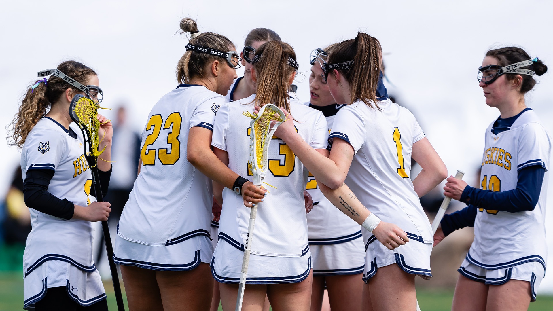 Southern Maine Women's Lacrosse Players Huddle in Game vs. UMF