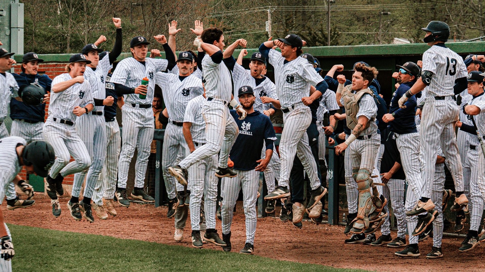 Huskies' Bench Celebrates Evan Baschnagel Home Run