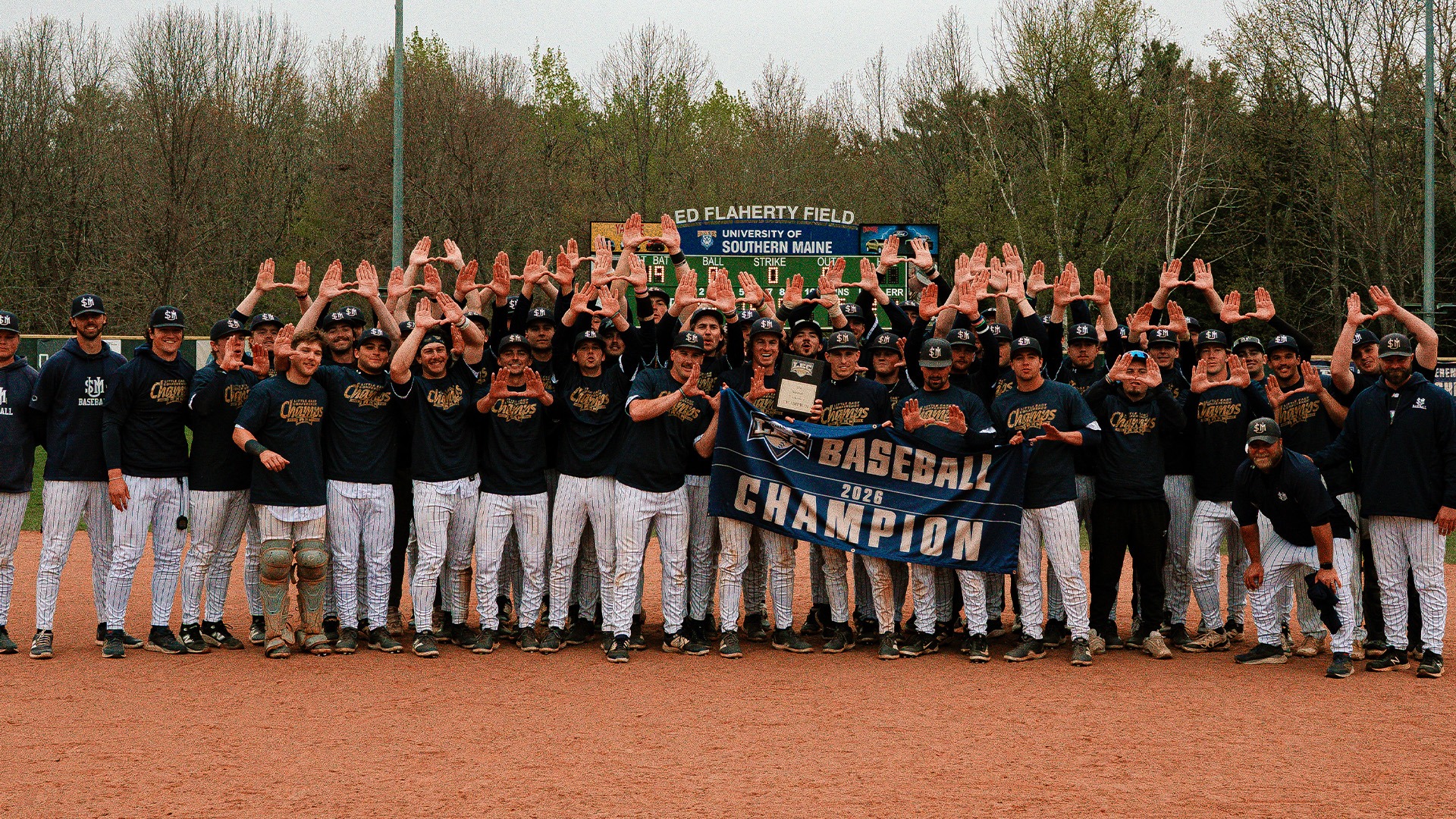Southern Maine Huskies with Little East Conference Banner