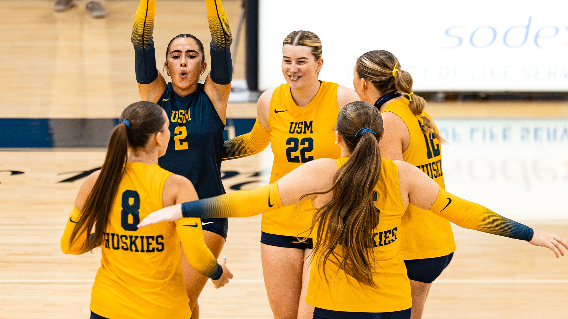 Huskies Celebrate in the Huddle vs. Bates