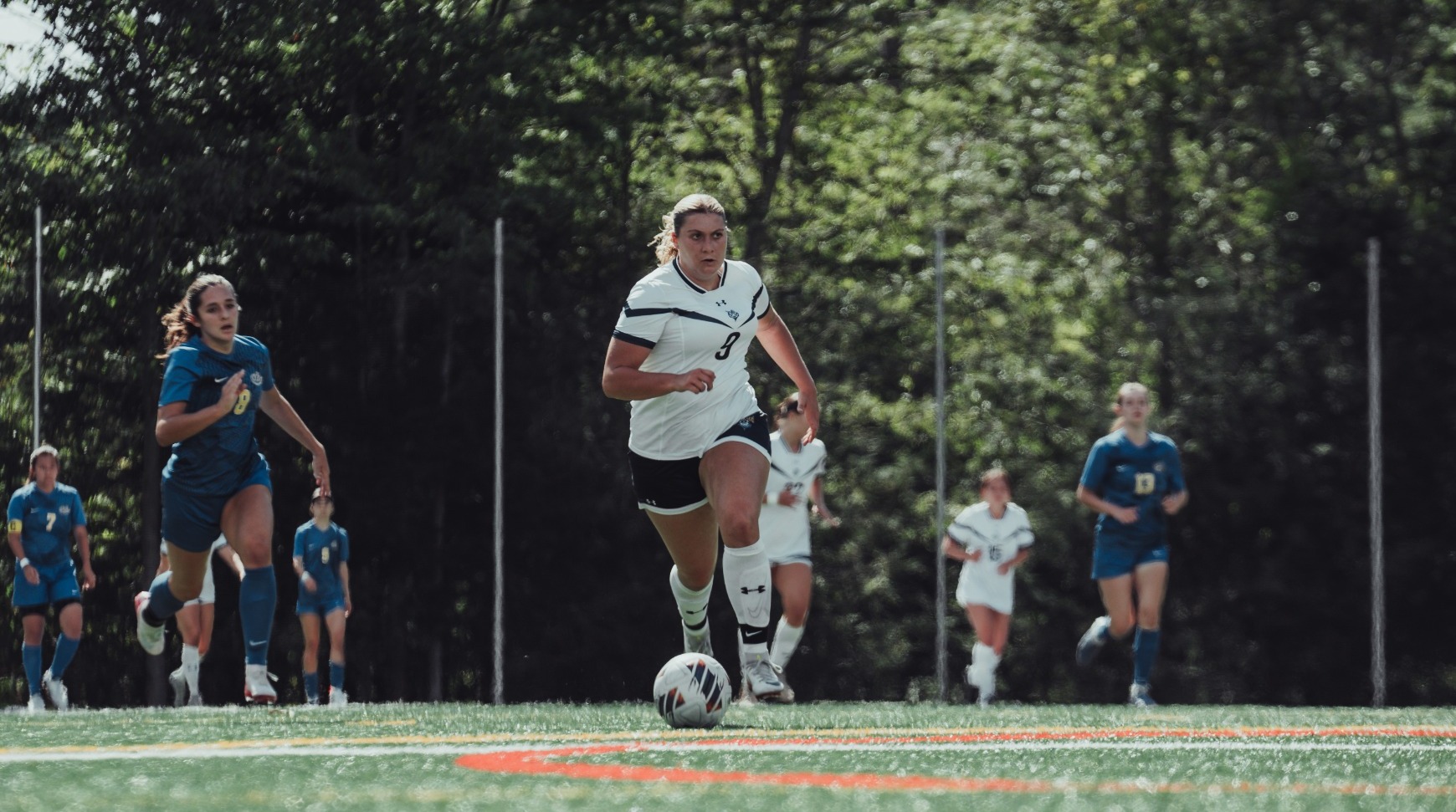 Lexi Morin making run with ball towards goal