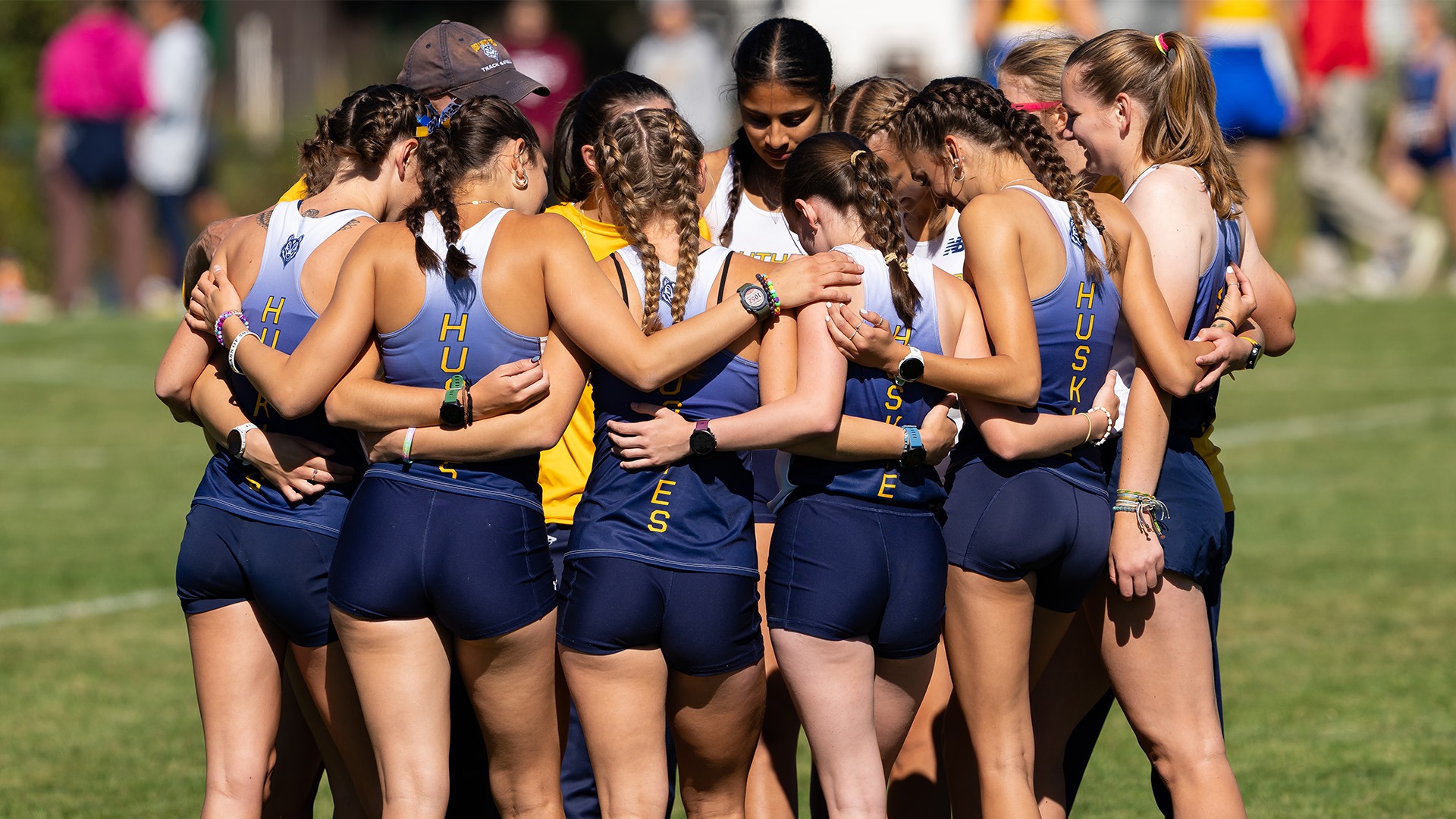 Southern Maine Women's Cross Country Team Huddles at 2025 Maine State Meet