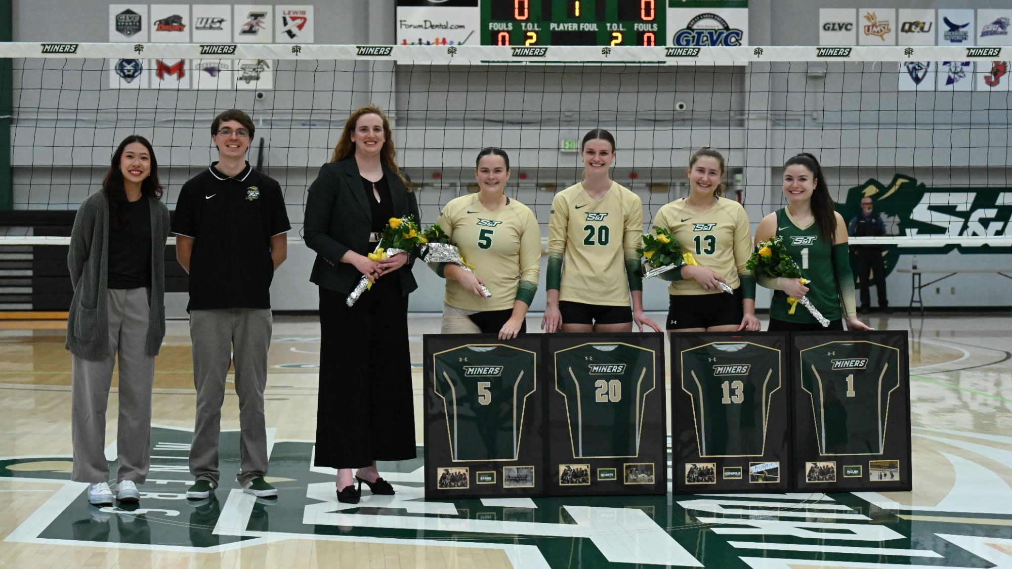 Senior Day photo of McClain, Arand, Mehaffy, and Kosmopolis with Coaches Cason, Piggott and Carrillo posing with their shadow box gifts