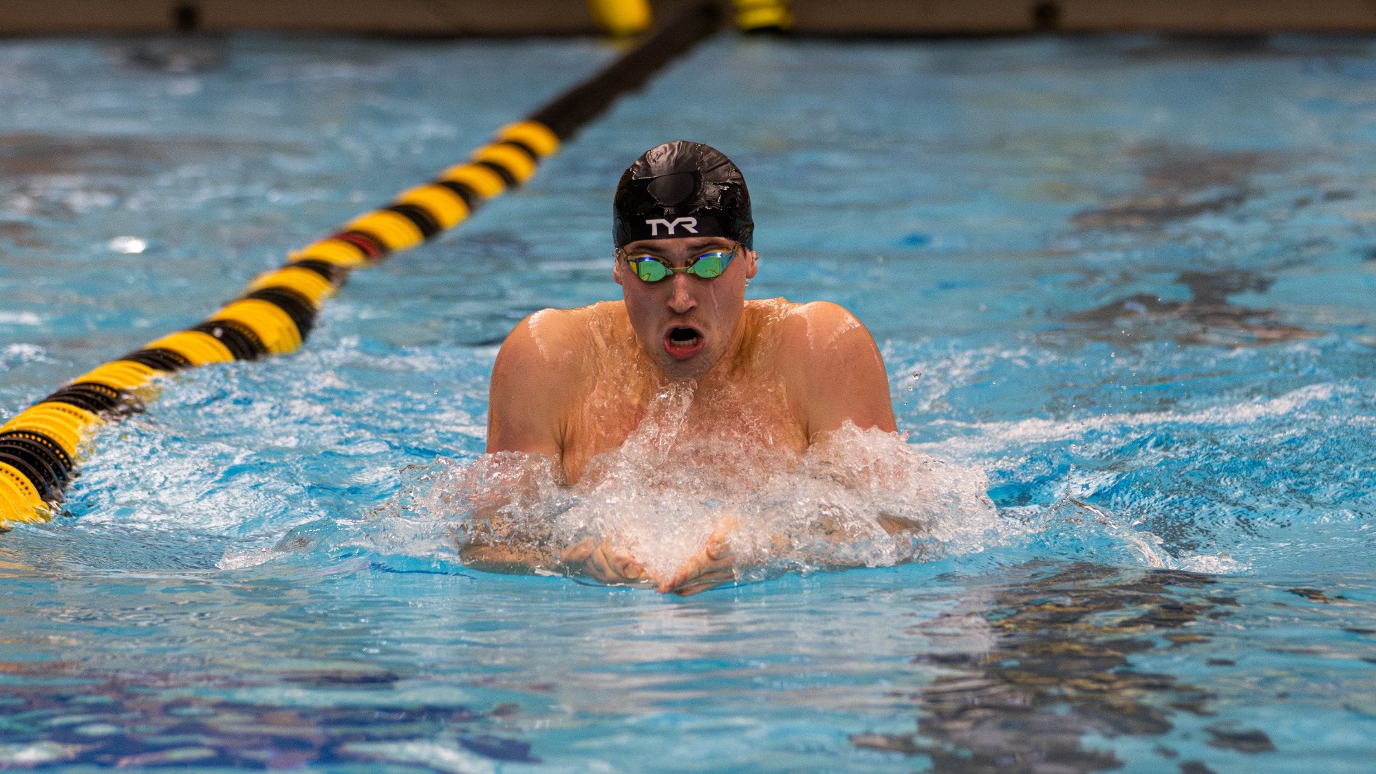 Connor Bichsel swimming the breaststroke at Mizzou