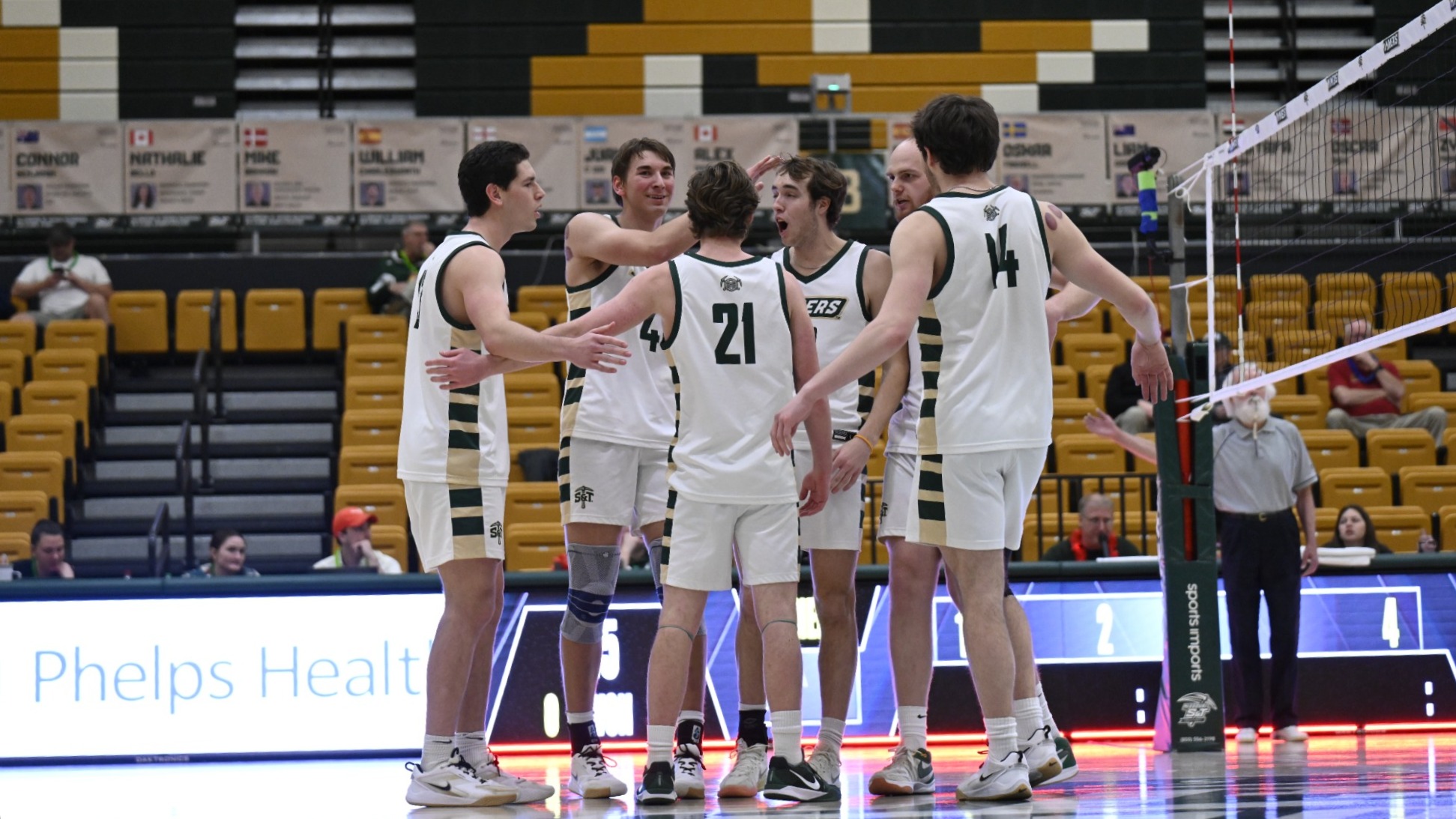 Men's Volleyball Team Huddling After a Point in Gibson Arena
