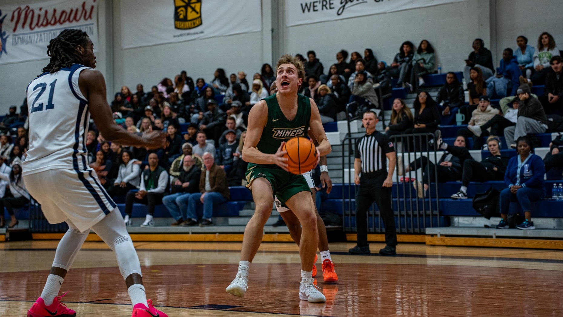Aidan Burns looking to take a shot while holding a basketball in a game against Lincoln of Missouri