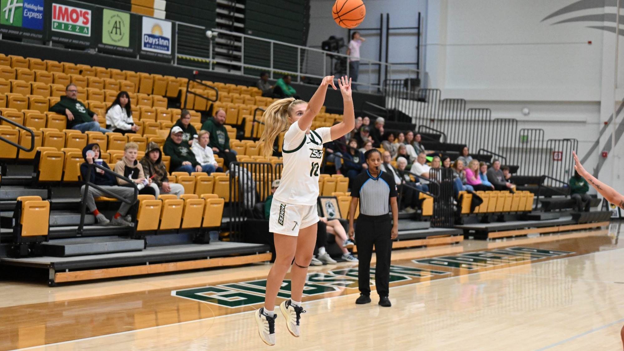 Adrianne Tolen shooting a three pointer in Gibson Arena