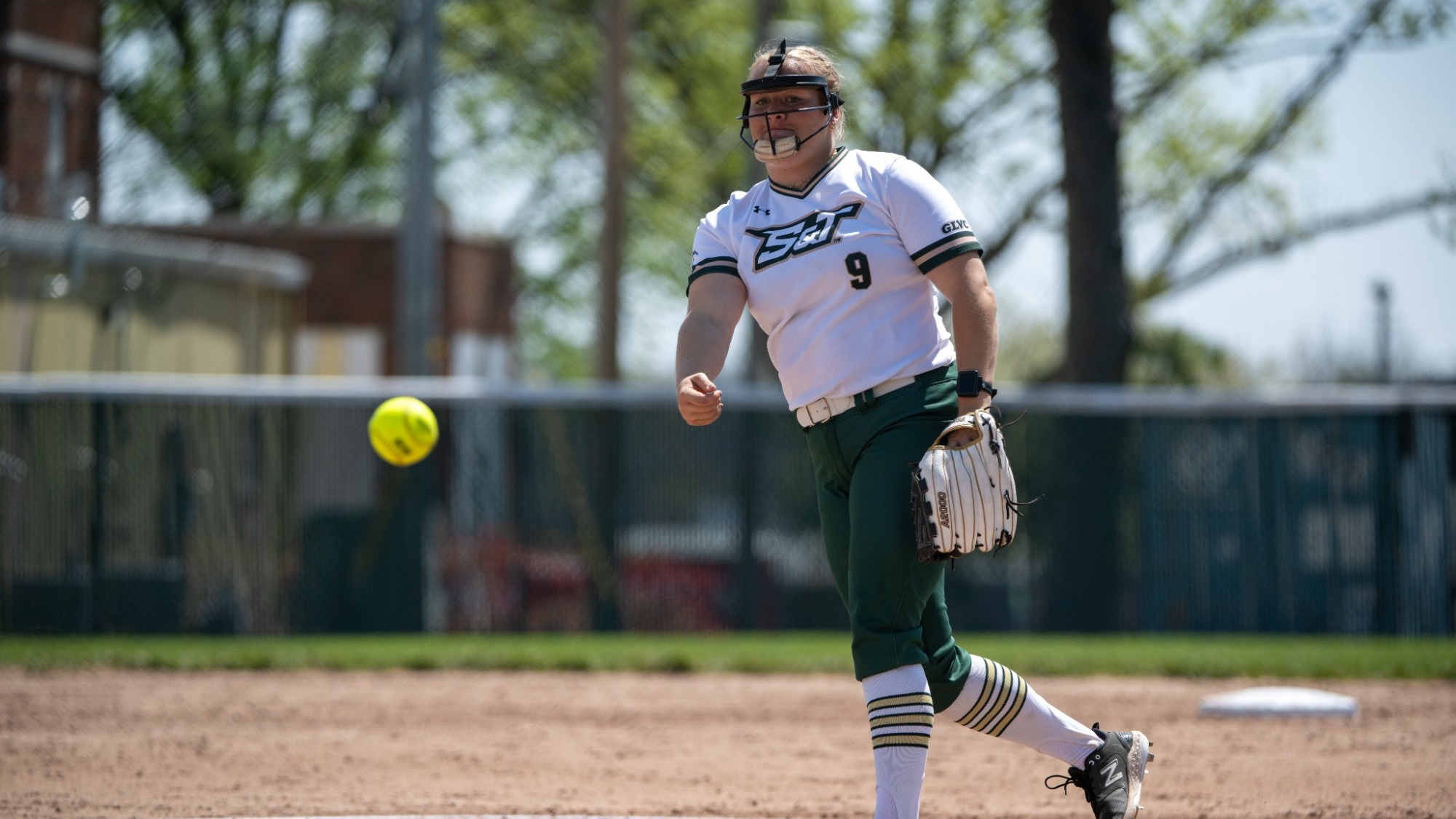 Mia Miller pitching the softball during a game 