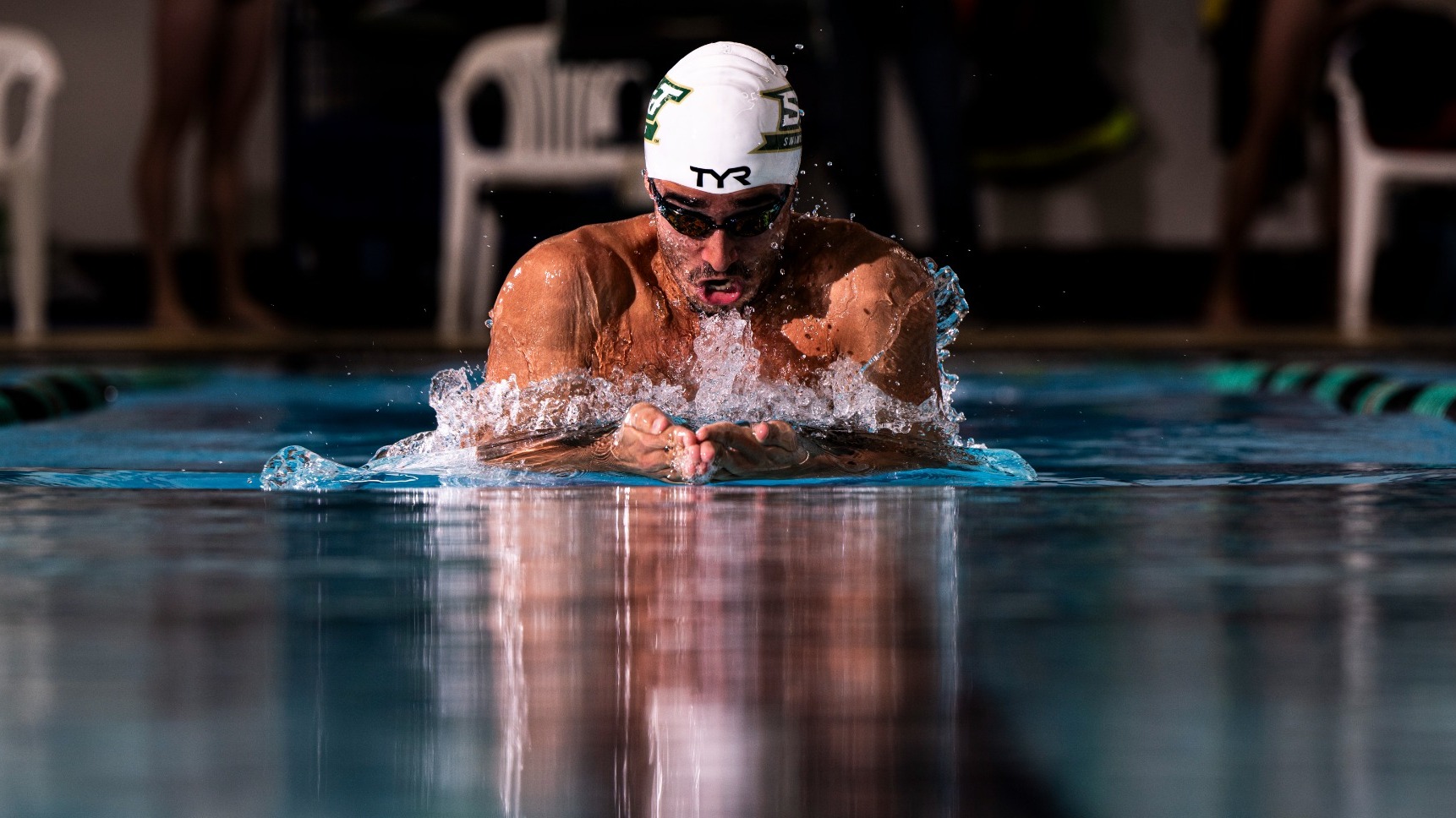 Photo of S&T swimmer doing the breaststroke in the S&T swimming pool