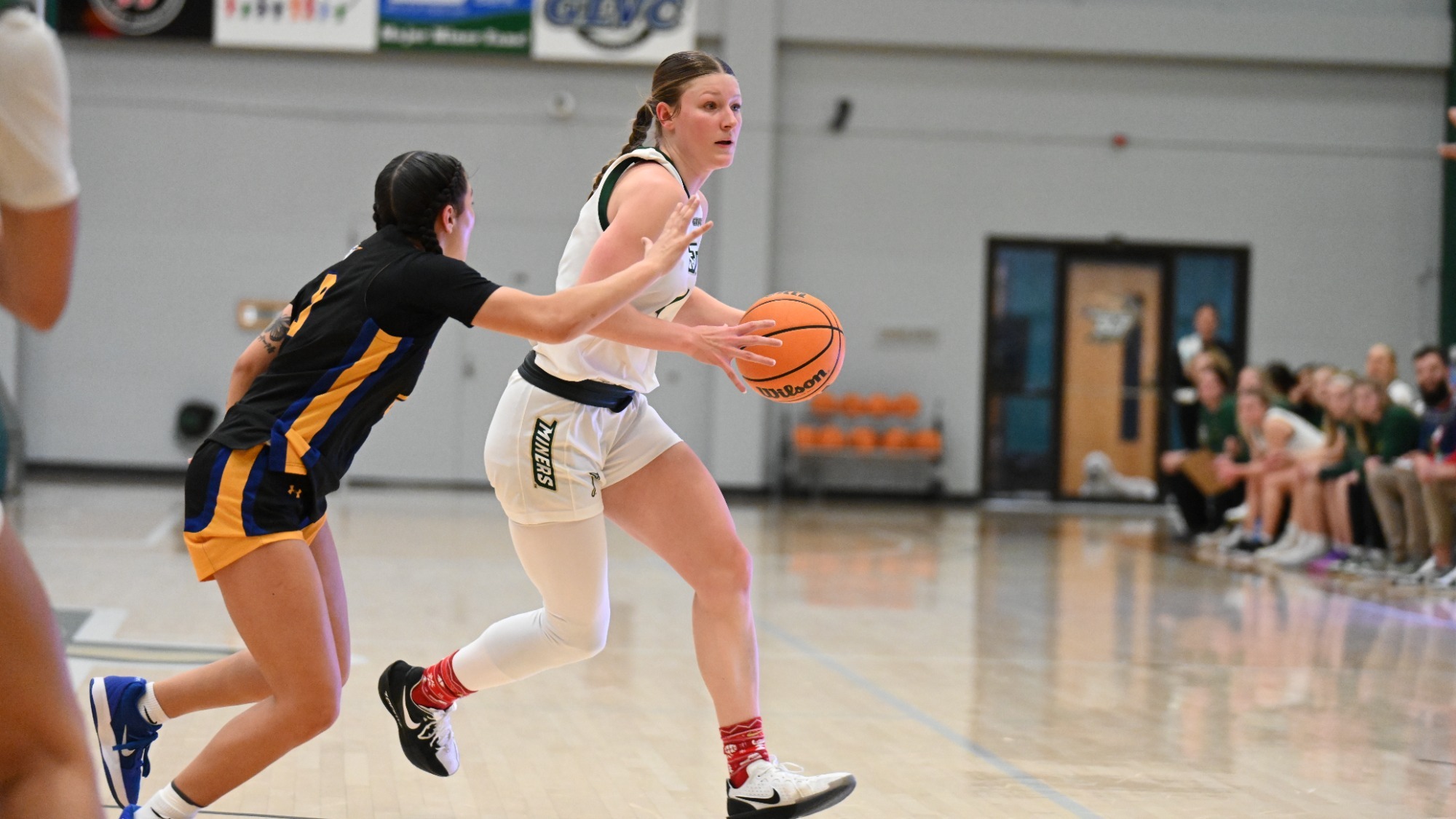 Norah Gum driving with a Spalding defender on her