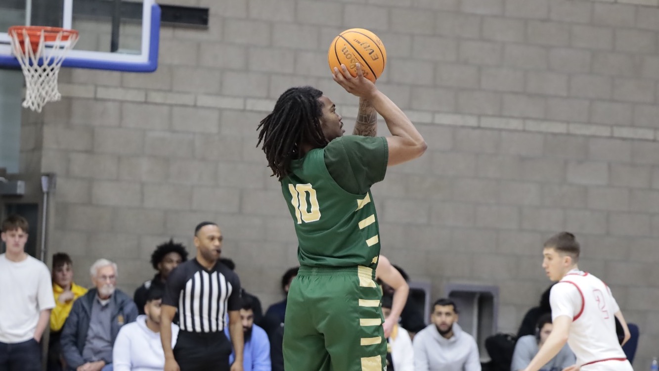 Missouri S&T men’s basketball layer Cameron Stovall pulling up to take a jump shot from just outside the paint in a game against Simon Fraser