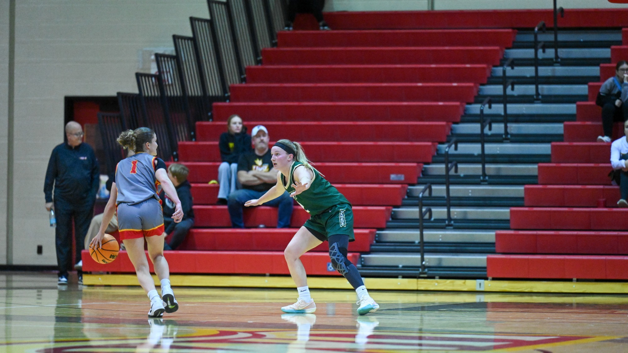 Anna Finley on defense guarding UMSL player.