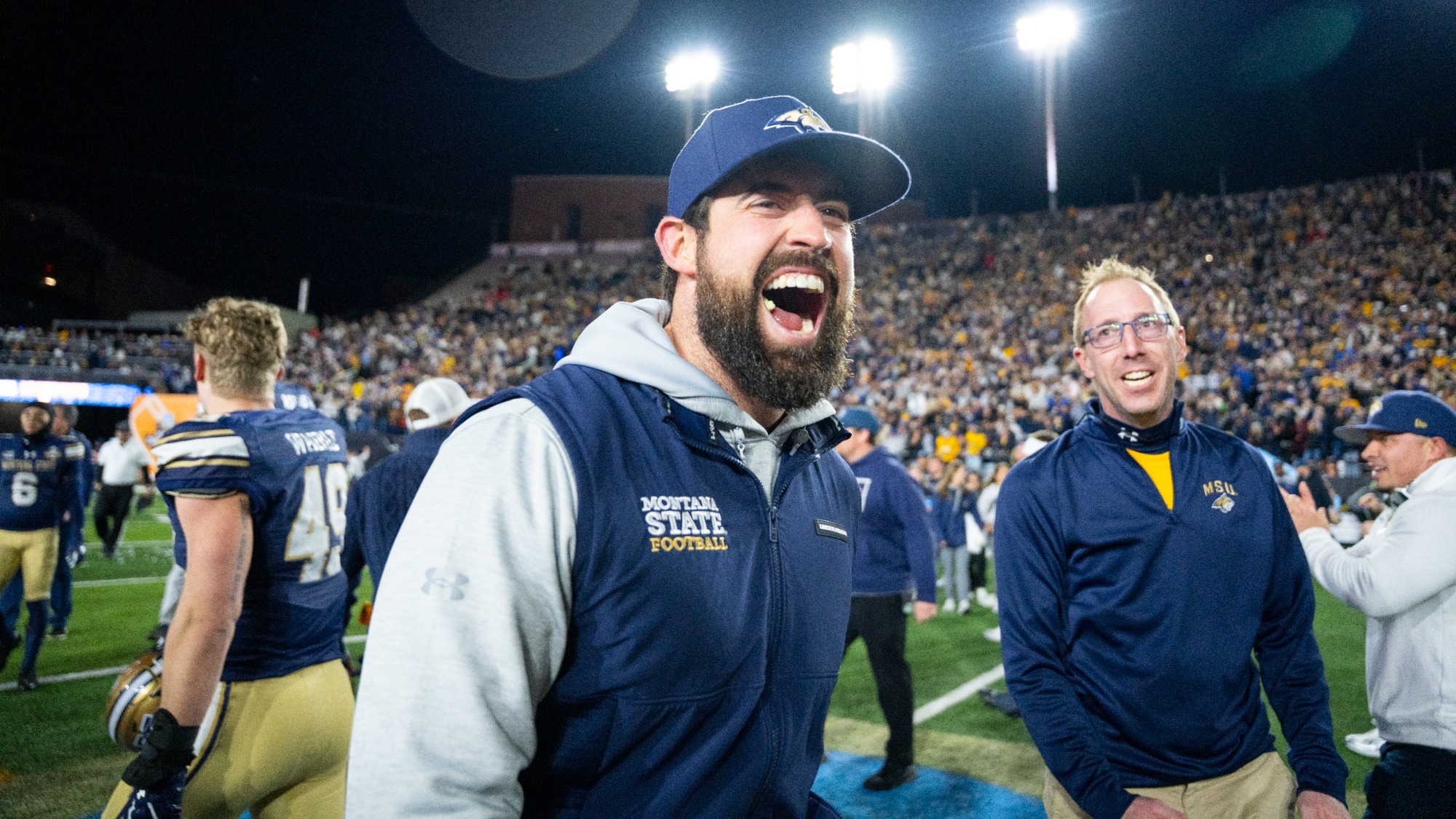 Photo of Coach Josh Firm in Montana State gearing celebrating after a win