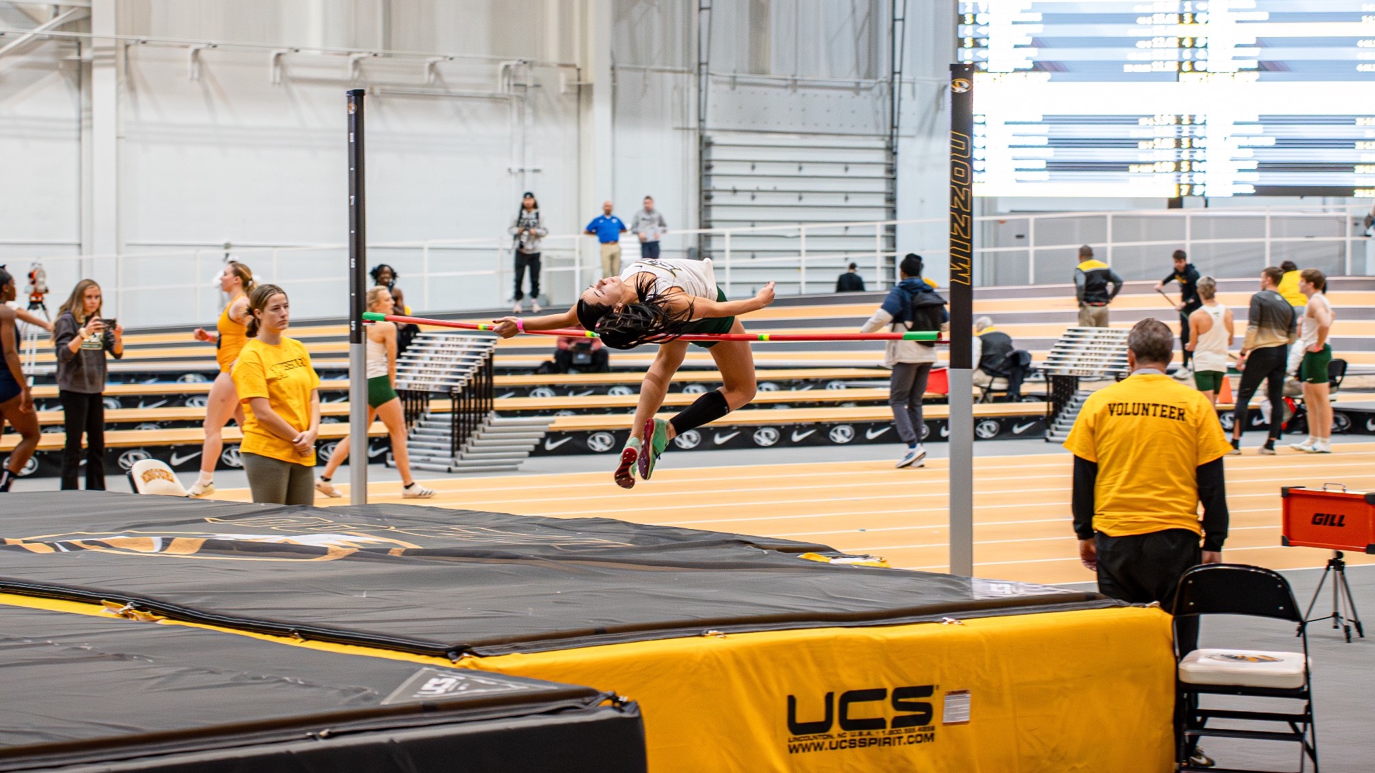 Missouri S&T Lauryn Fenoglio mid high jump form while competing at the Show Me Showdown at Mizzou.
