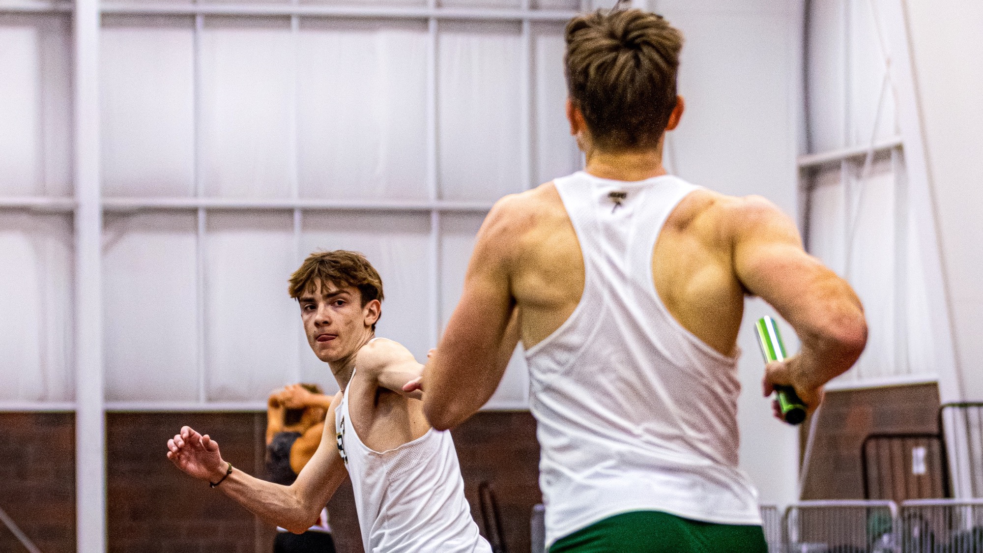 Missouri S&T track runner Otto Knittel handing off the baton to Jack Janovick during the 4,000m distance medley relay.