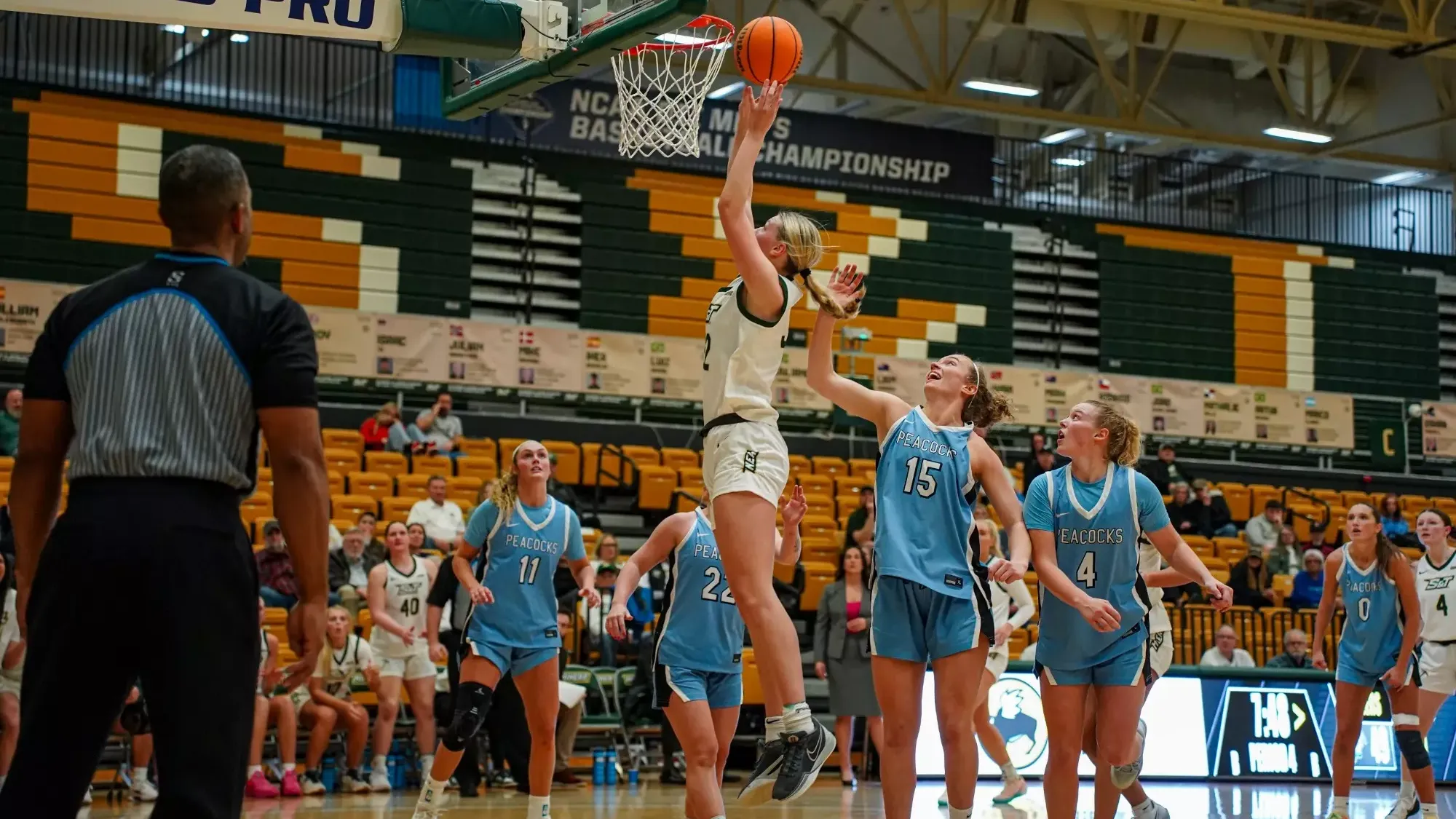 Missouri S&T women’s basketball player Ava McCulla rises for a post move in the paint, surrounded by Upper Iowa defenders in light blue, during a game at Gibson Arena.
