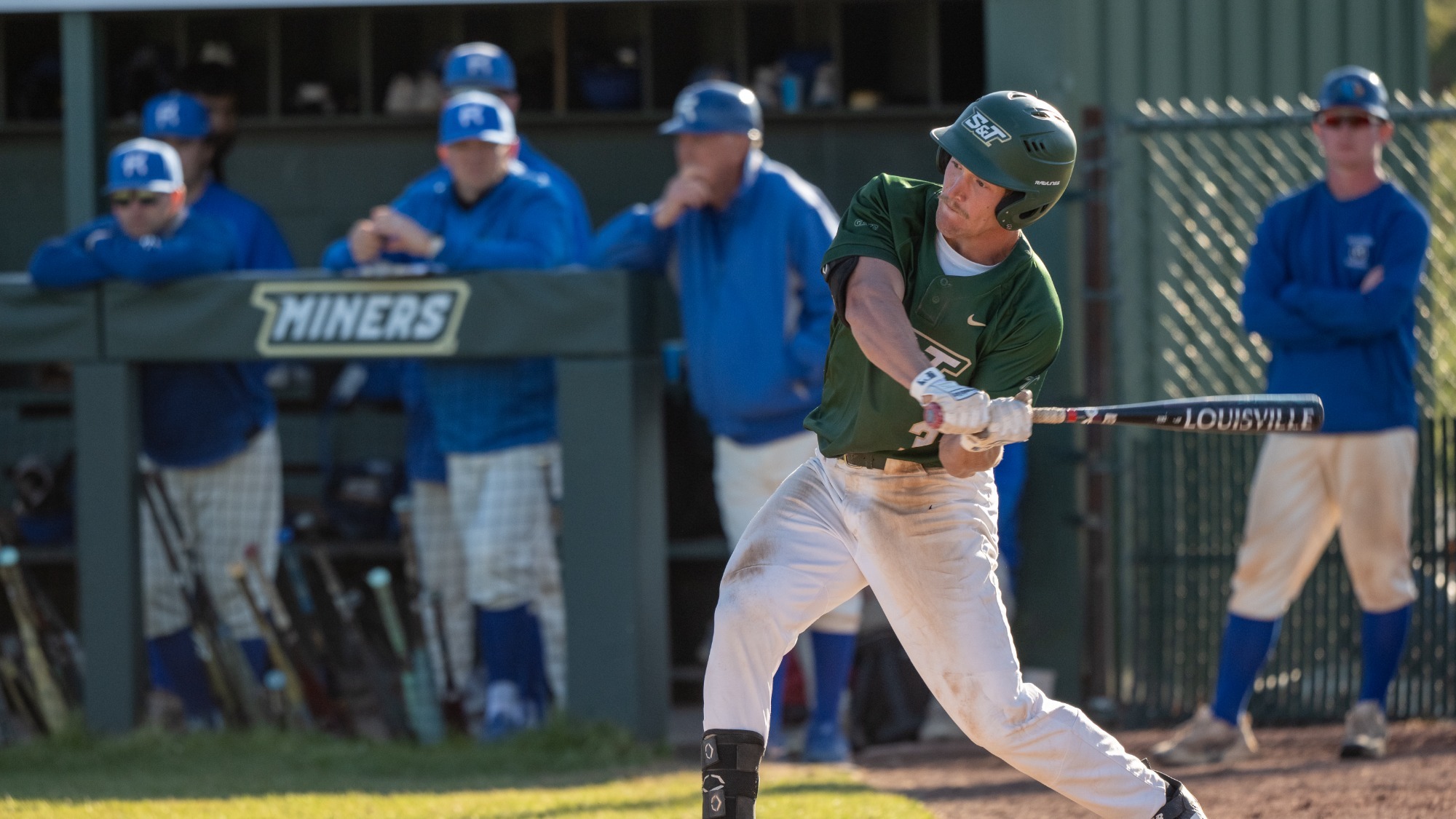 Will Beckham of the Missouri S&T Baseball team is photographed mid-swing during an at bat during a game at the Ballpark at S&T during a game vs the Rockhurst Hawks