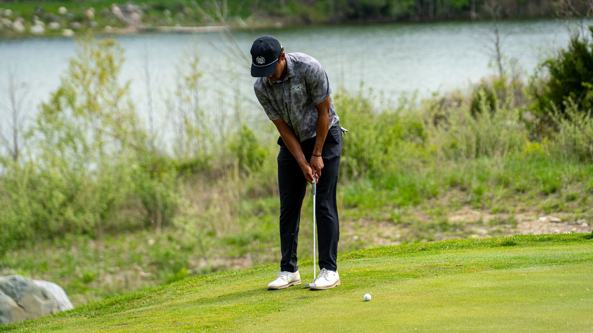 Li Kasule of Missouri S&T lines up a putt during the GLVC Championships at Rock Hollow Golf Course.