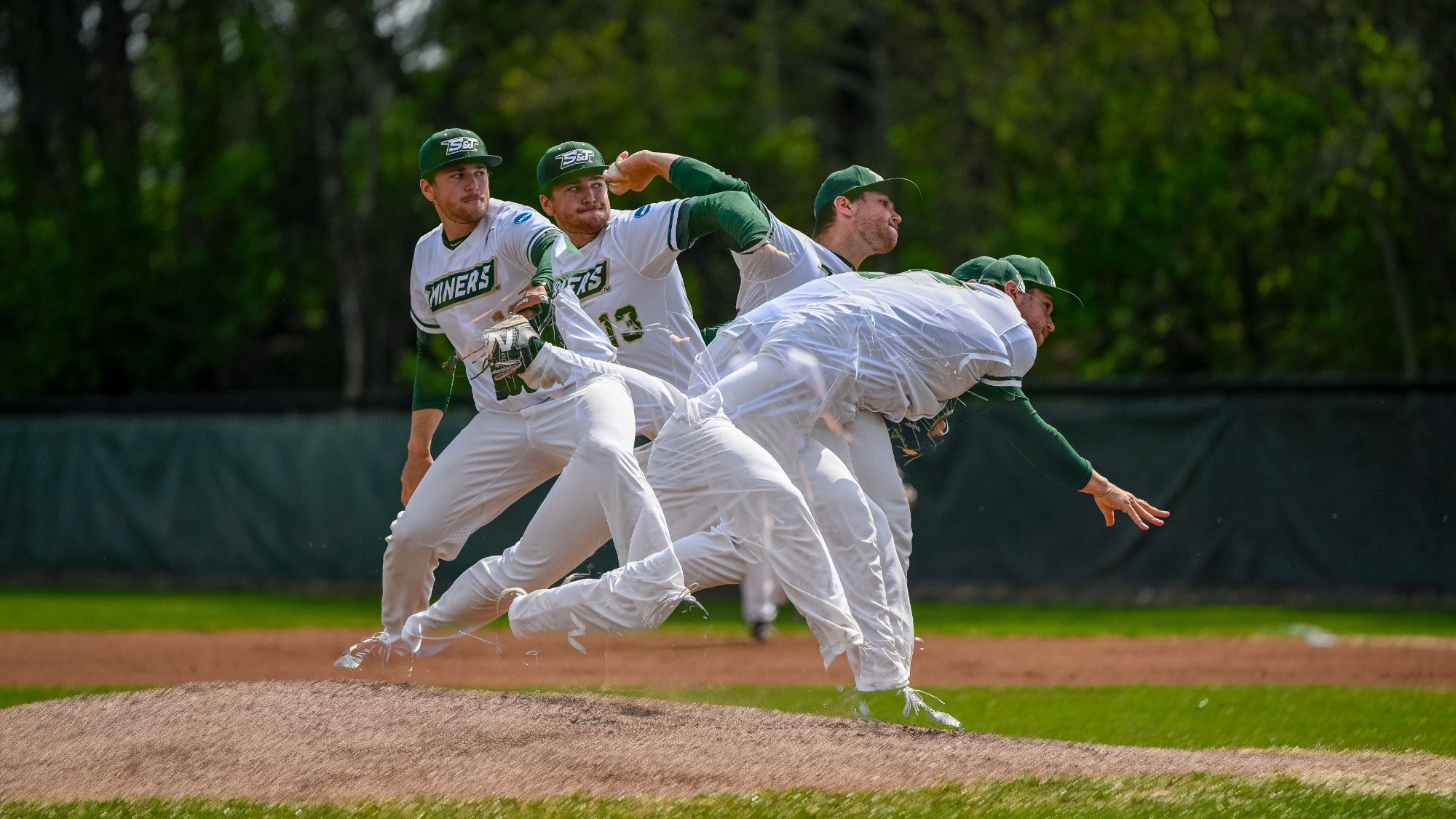 Dylan Bates of Missouri S&T Baseball photographed in a timelapse photo of him pitching the ball while on the mound. He is shown at multiple phases from wind up to release. He is wearing a white S&T jersey with a green baseball cap.