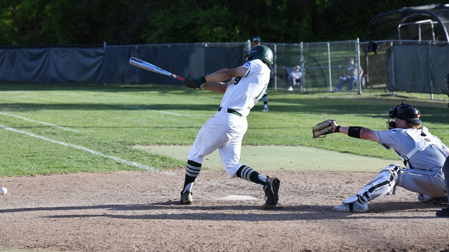Drew Baugus of Missouri S&T Baseball photographed swinging the bat during an at bat in a baseball game at the Ballpark at S&T