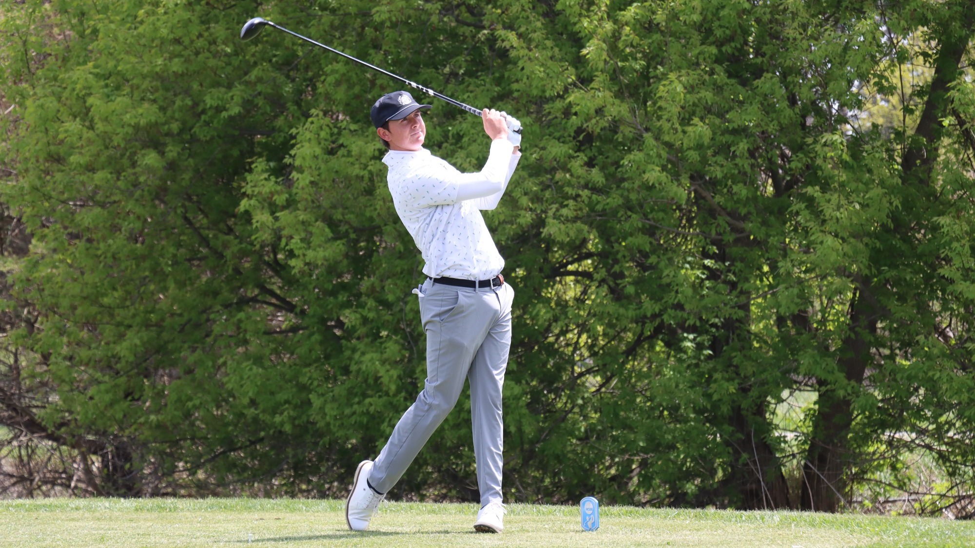 Cole Komyati of Missouri S&T Golf photographed during his follow through while teeing off during round two of the NCAA Midwest/Central Super Regional.