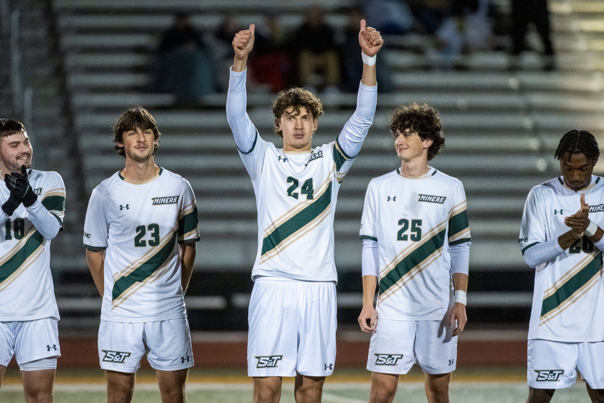 Jake Salazar-Blair waving to the crowd as starting lineups are announced