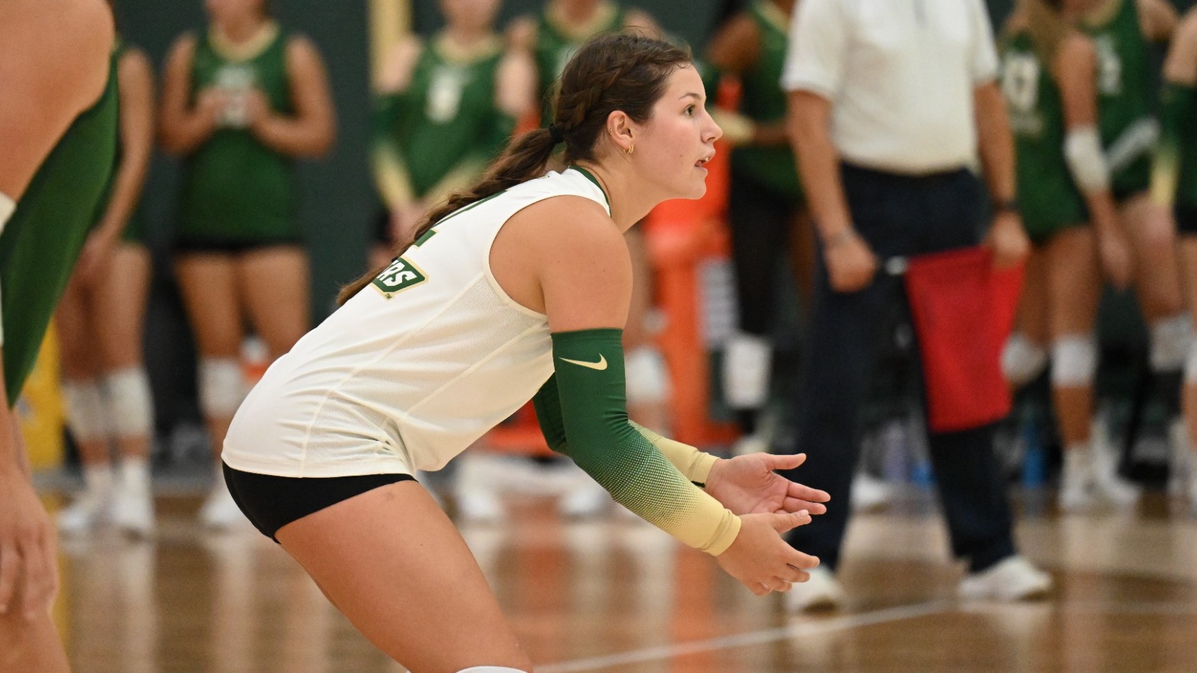 Adelyn Weiler of Missouri S&T women's volleyball photographed wearing a white uniform while in a ready stance waiting to receive a serve