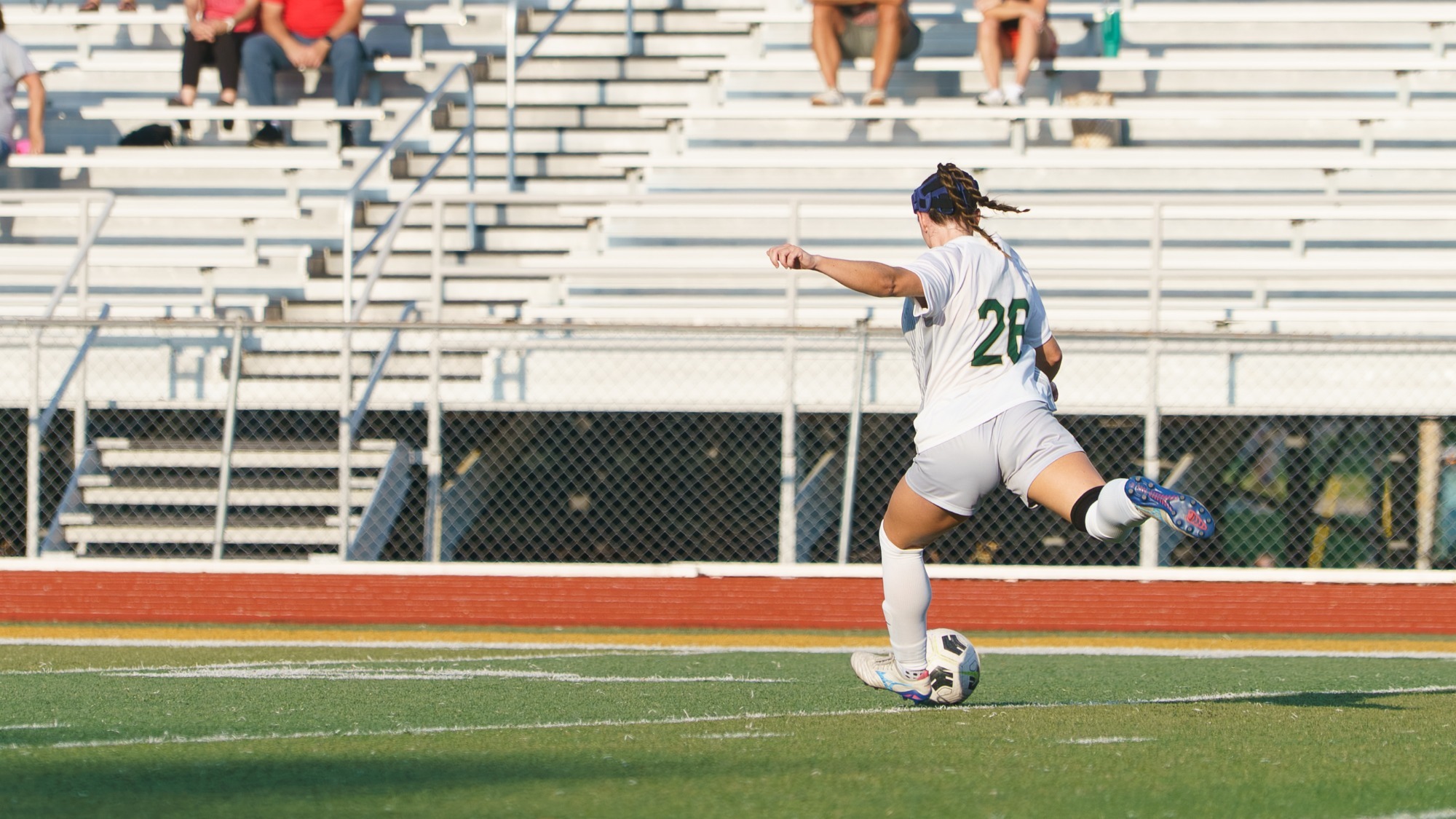 Morgan Pack of Missouri S&T Women's Soccer photographed while wearing a white and gray uniform with the green number 